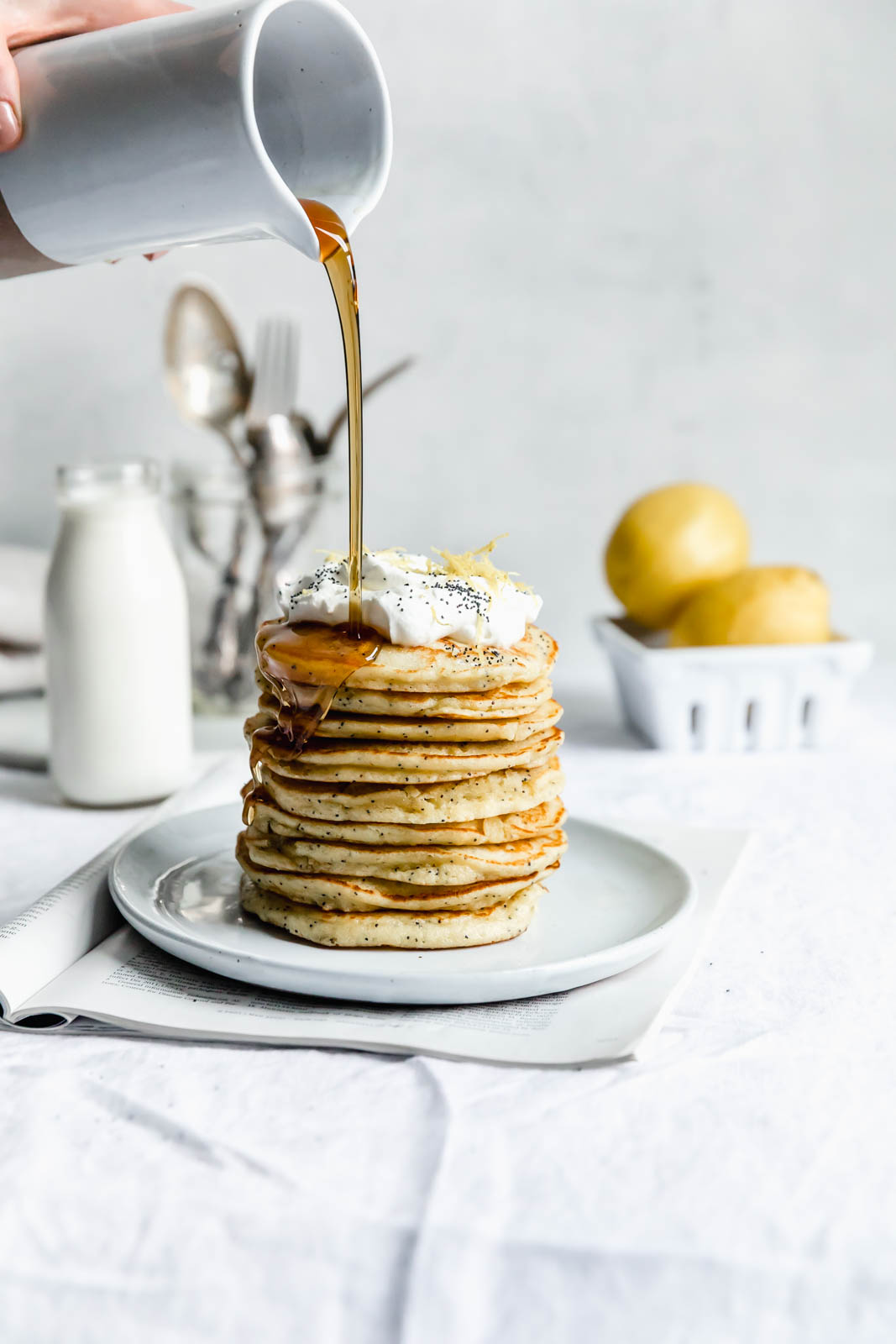 Light and fluffy Gluten Free Lemon Poppy Seed Pancakes made with almond flour and lemon zest. But proceed with caution: you might eat the whole batch!