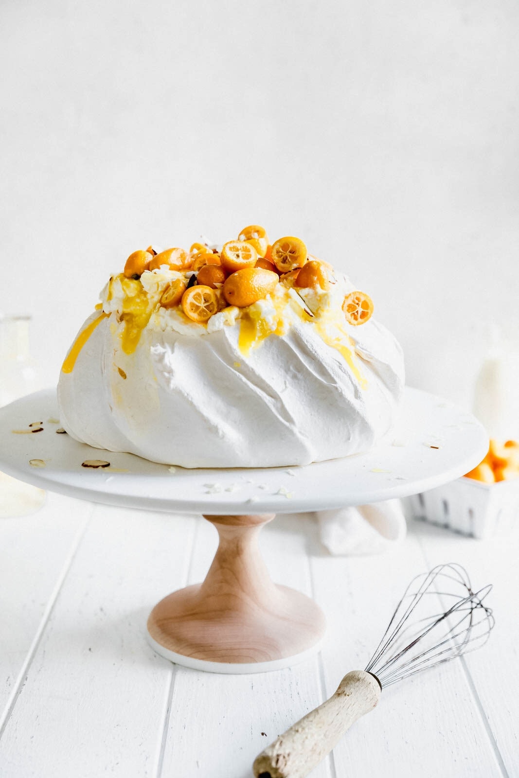 Make everyone say HUBBA HUBBA with this showstopping white chocolate and lemon curd pavlova topped with baby kumquats and sliced almonds.