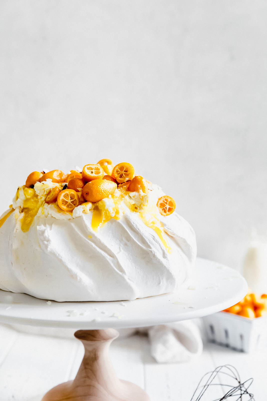 Make everyone say HUBBA HUBBA with this showstopping white chocolate and lemon curd pavlova topped with baby kumquats and sliced almonds. 