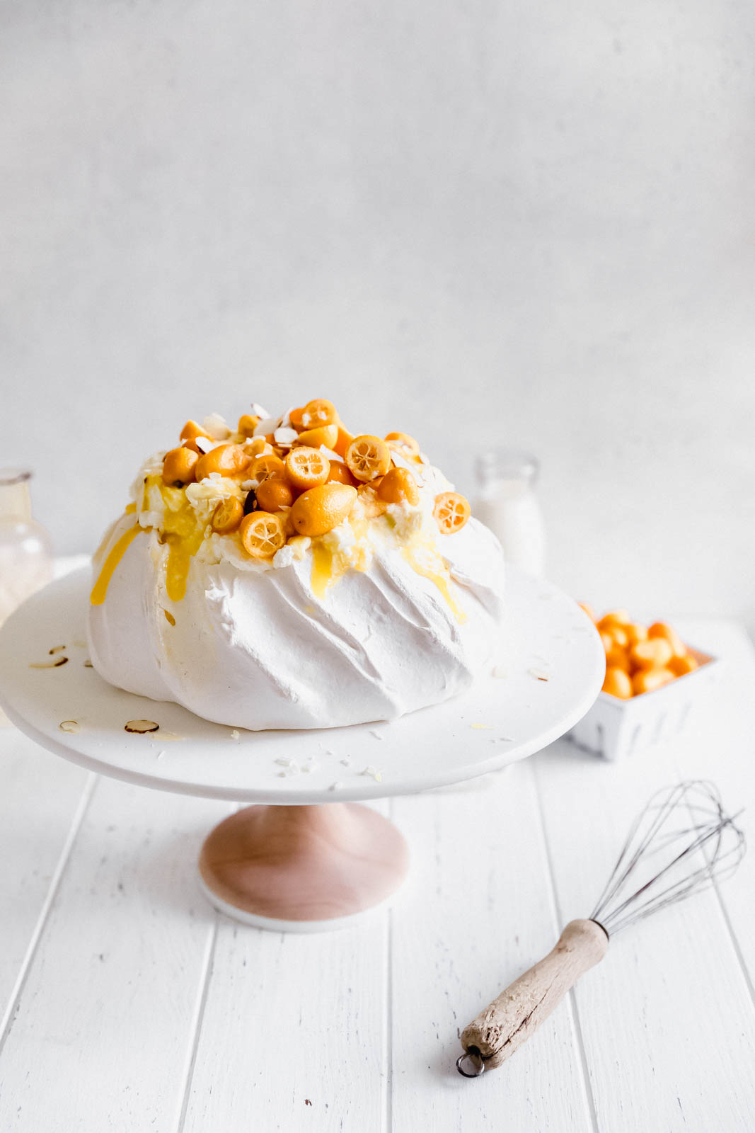 Make everyone say HUBBA HUBBA with this showstopping white chocolate and lemon curd pavlova topped with baby kumquats and sliced almonds. 