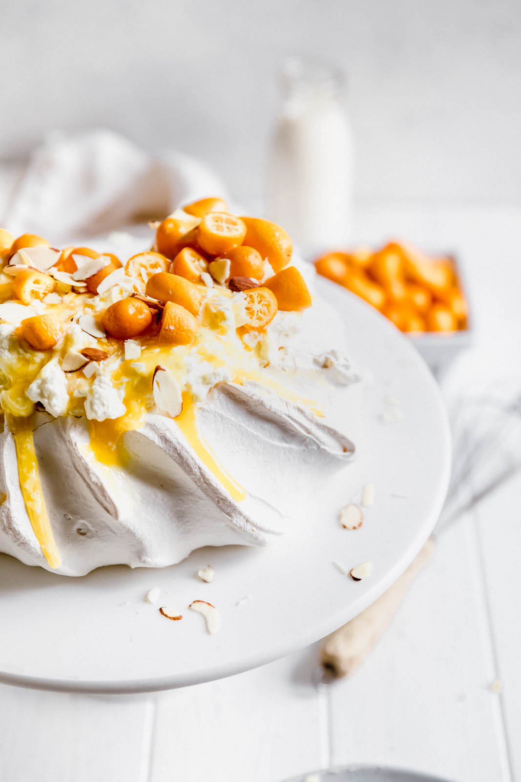 Make everyone say HUBBA HUBBA with this showstopping white chocolate and lemon curd pavlova topped with baby kumquats and sliced almonds. 