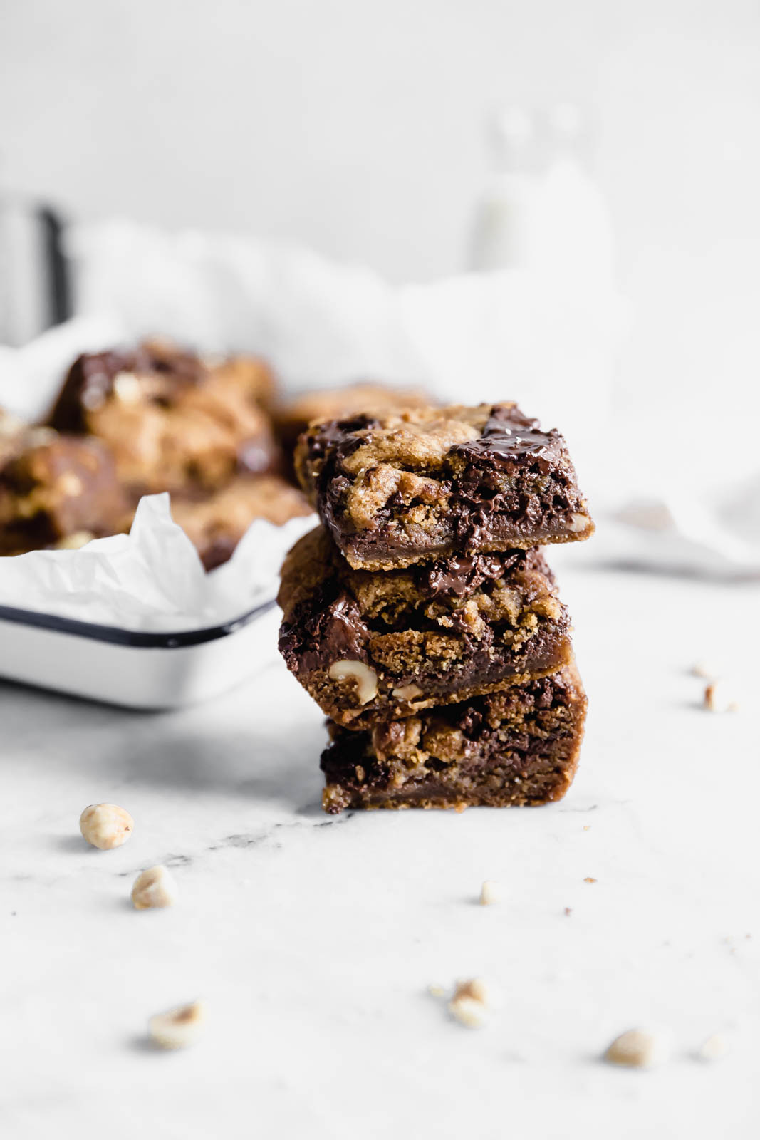 Brown Butter Nutella Chocolate Chip Cookie Bars with fat swirls of Nutella and lightly toasted hazelnuts. A salty sweet treat sure to be a showstopper.