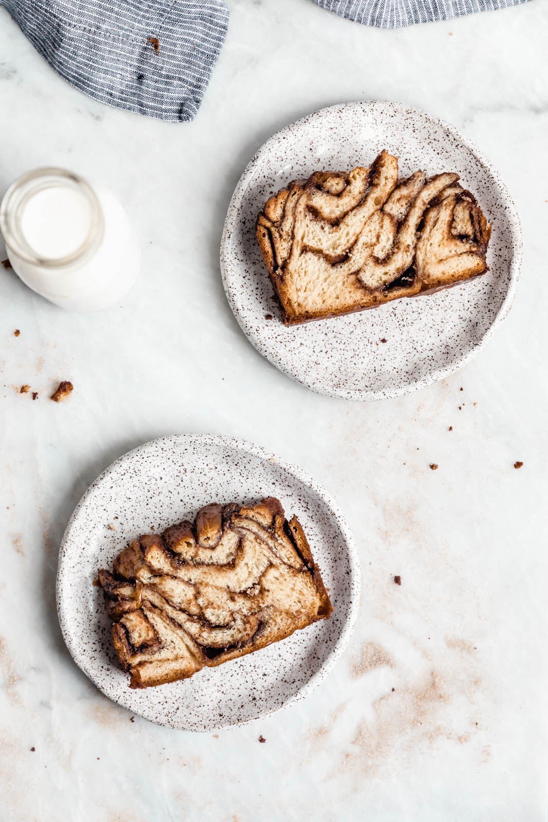Buttery, flaky dough swirled together with cinnamon AND chocolate make this stunning Cinnamon Chocolate Babka. Step by step instructions on how to make the perfect babka!