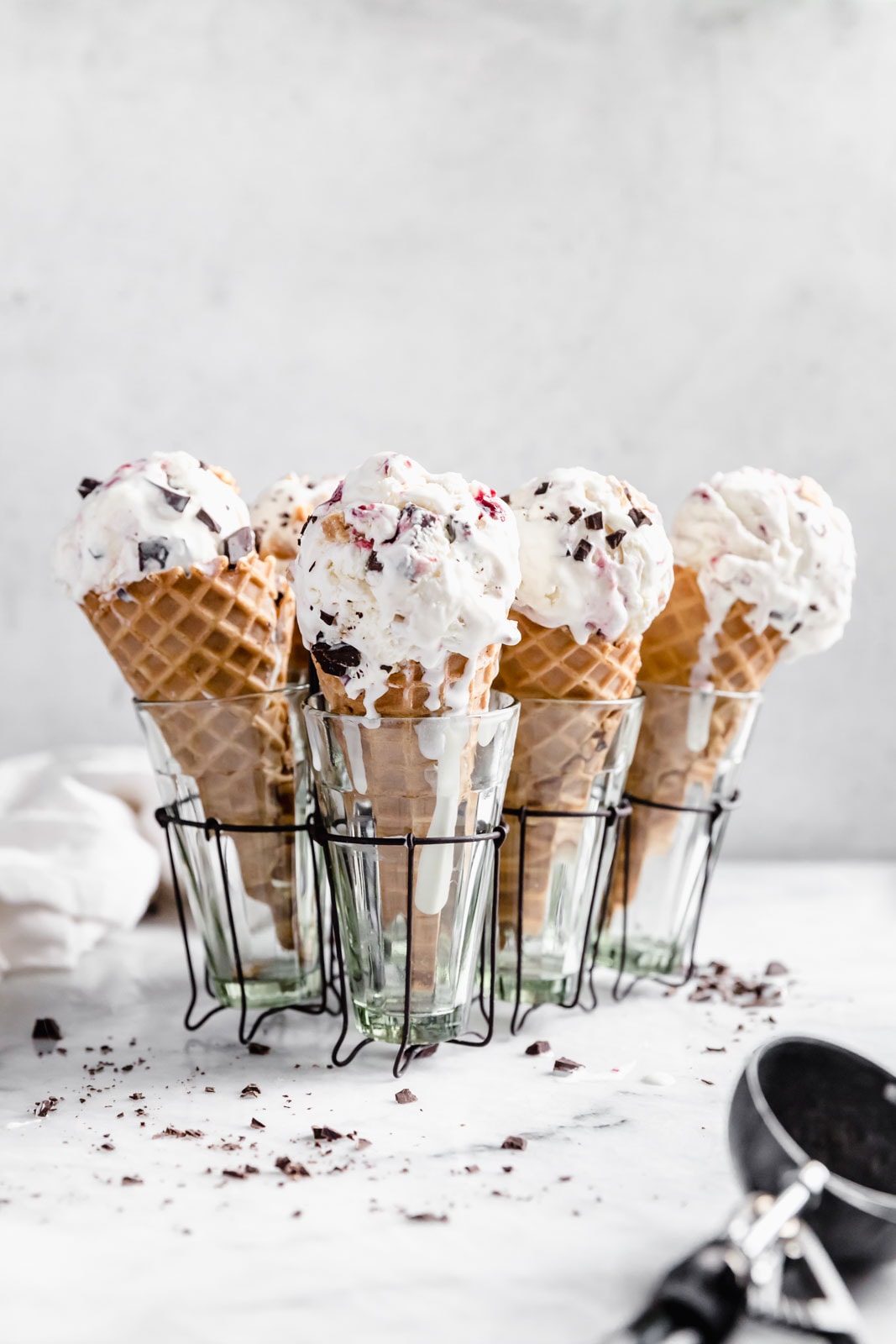 This creamy vanilla ice cream with fat blackberry swirls, buttery waffle pieces, and chocolate chips has us in heaven. Whip up this no churn blackberry waffle chocolate chip ice cream in minutes and skip the line at the ice cream shop.