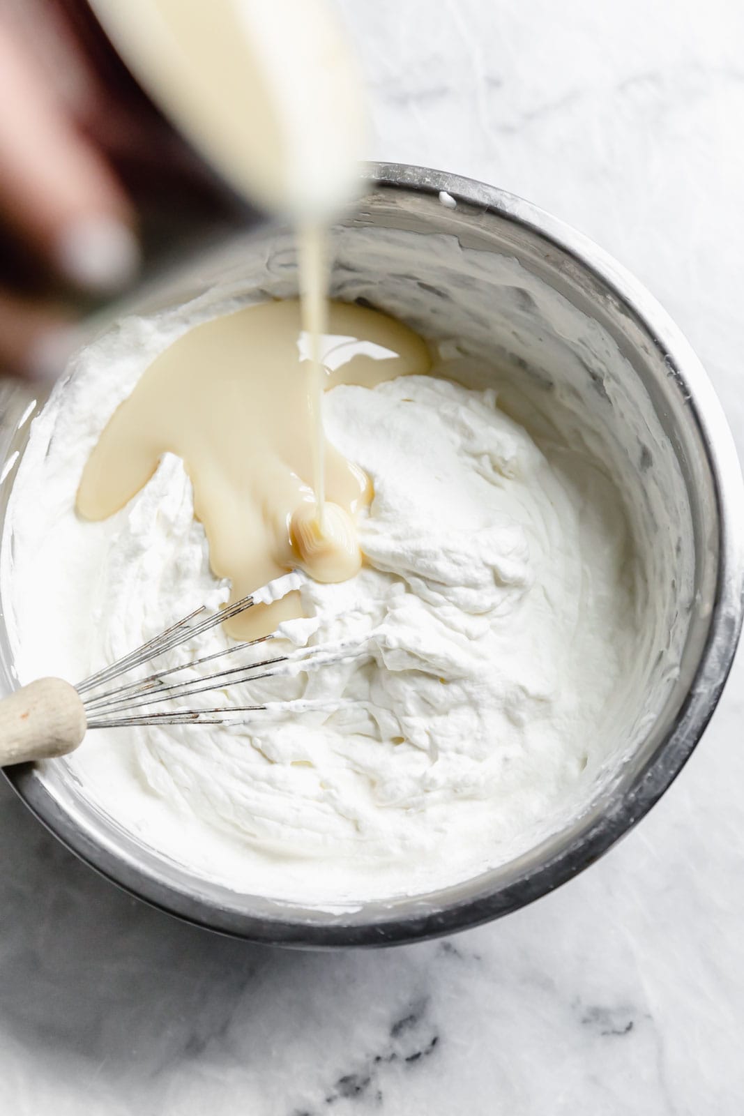 This creamy vanilla ice cream with fat blackberry swirls, buttery waffle pieces, and chocolate chips has us in heaven. Whip up this no churn blackberry waffle chocolate chip ice cream in minutes and skip the line at the ice cream shop.