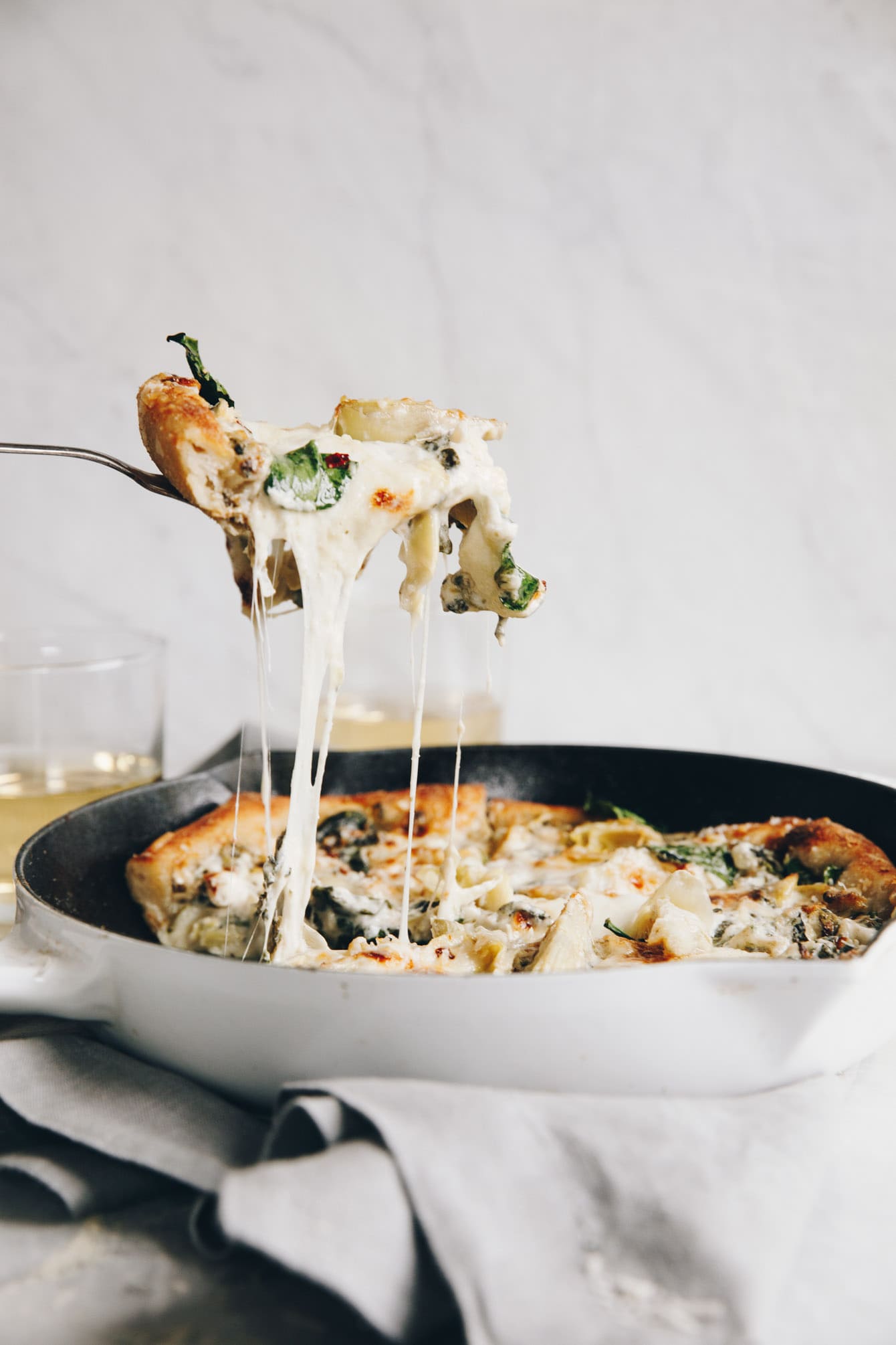Easy cheesy spinach artichoke pizza so delicious, you'll eat the whole pie yourself
