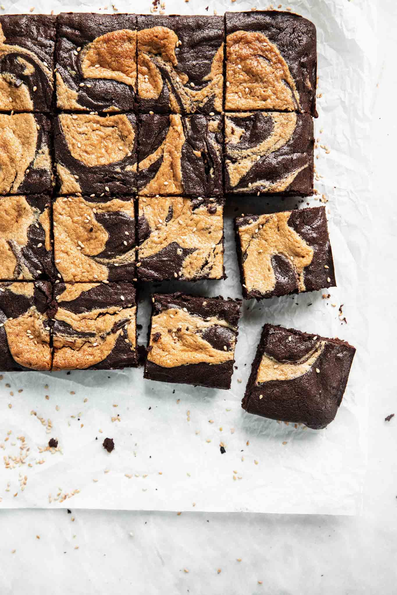 Introducing Halva Brownies AKA thick fudgy brownies swirled with ribbons of halva, my favorite middle eastern confection. Think tahini brownies, but better!