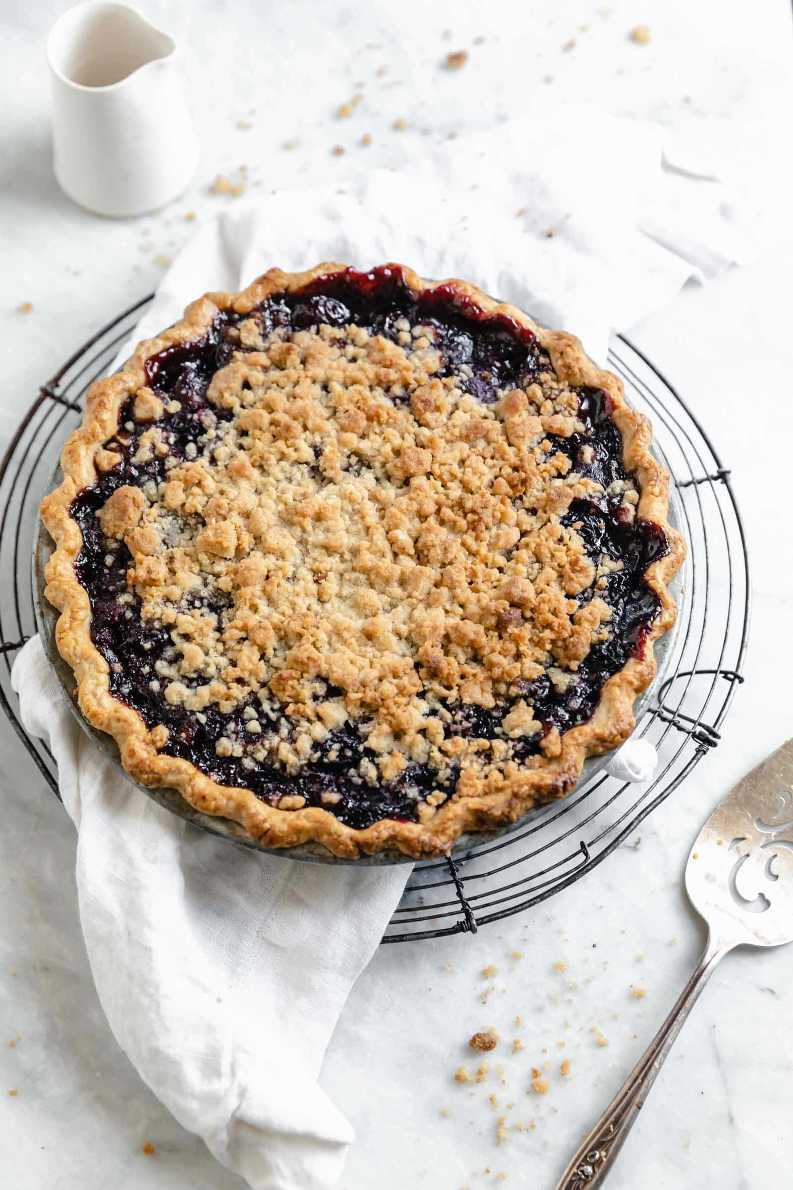 whole cherry pie on a cooling rack