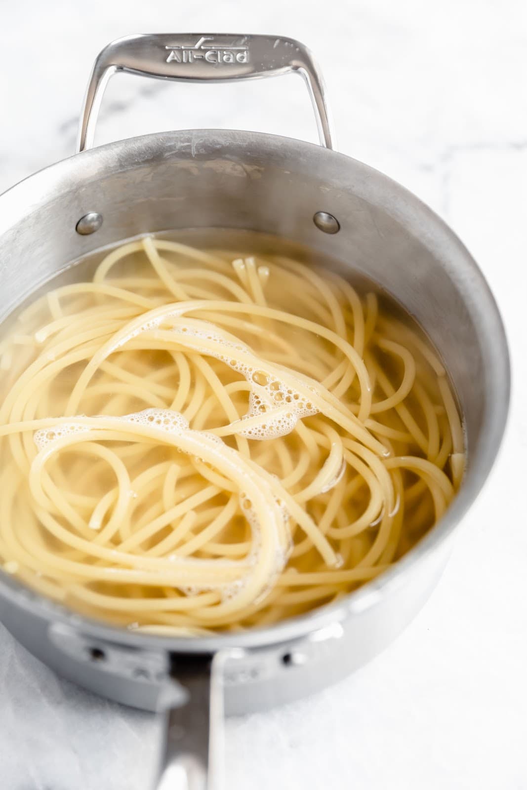 A creamy Roman classic made with bucatini, guanciale, parmigiano, and egg yolks, this Date Night Pasta Carbonara is perfectly portioned for two!