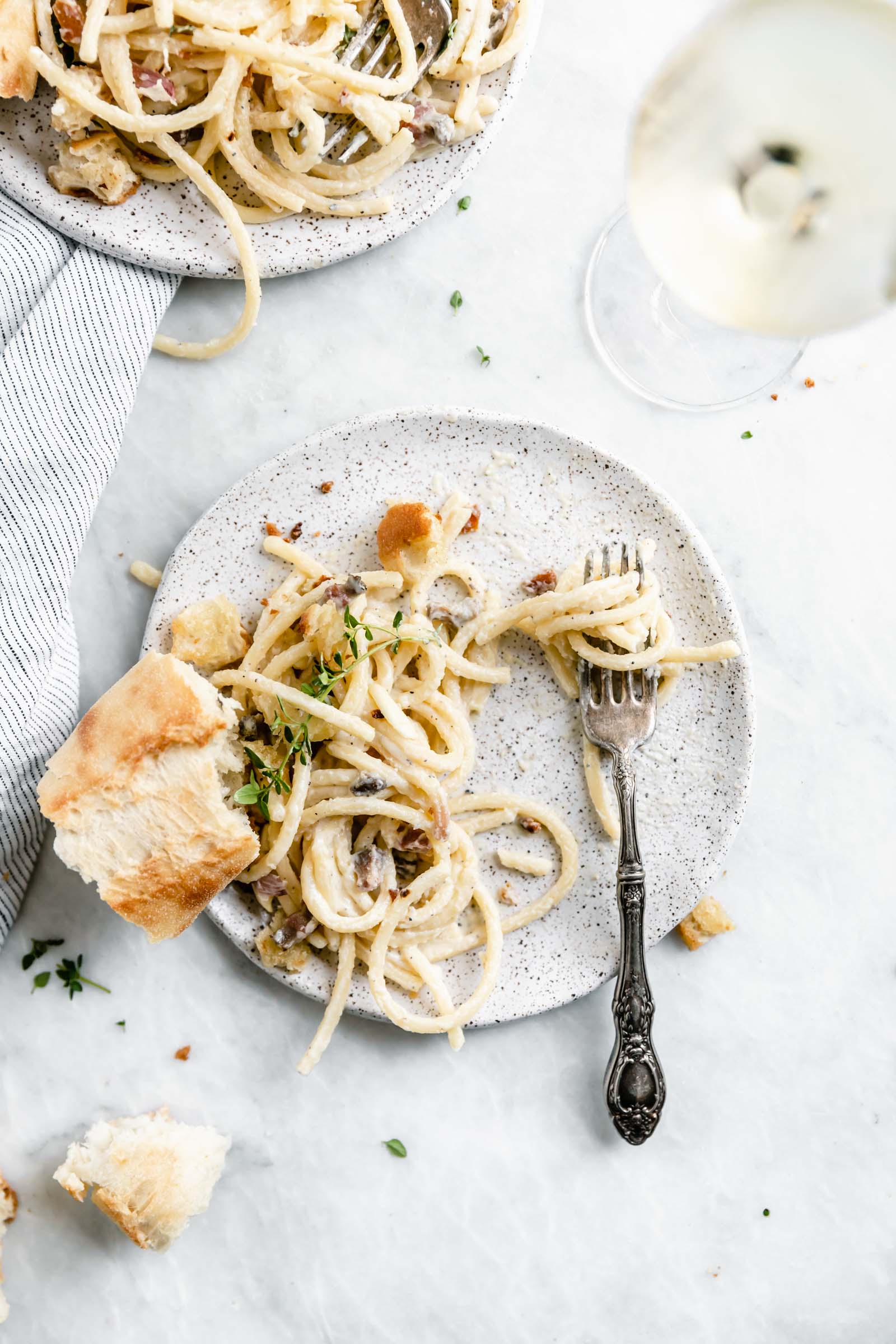 A creamy Roman classic made with bucatini, guanciale, parmigiano, and egg yolks, this Date Night Pasta Carbonara is perfectly portioned for two!