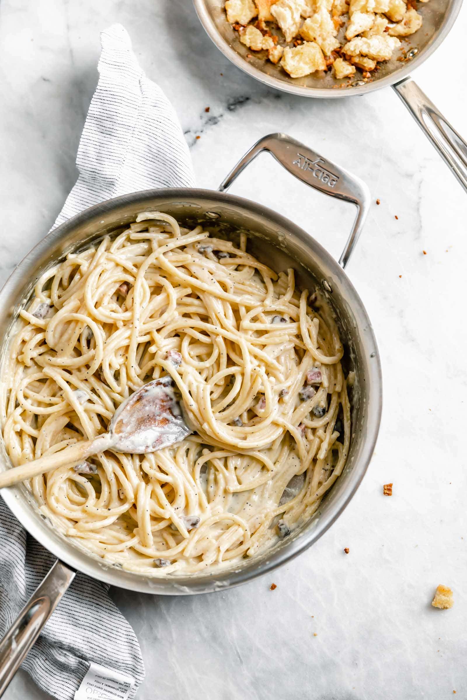 A creamy Roman classic made with bucatini, guanciale, parmigiano, and egg yolks, this Date Night Pasta Carbonara is perfectly portioned for two!
