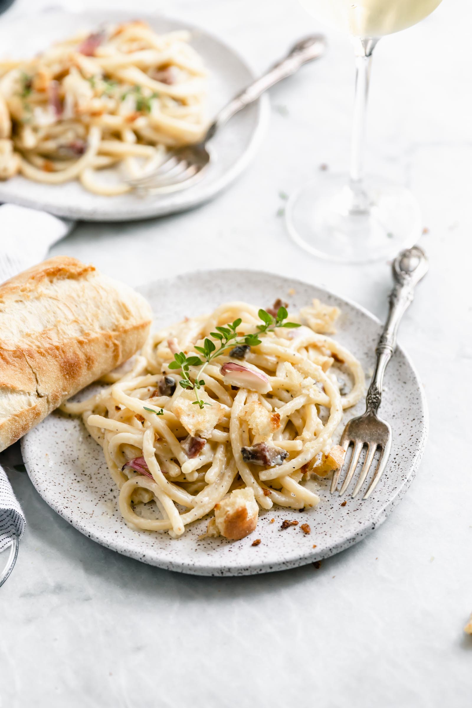 A creamy Roman classic made with bucatini, guanciale, parmigiano, and egg yolks, this Date Night Pasta Carbonara is perfectly portioned for two!