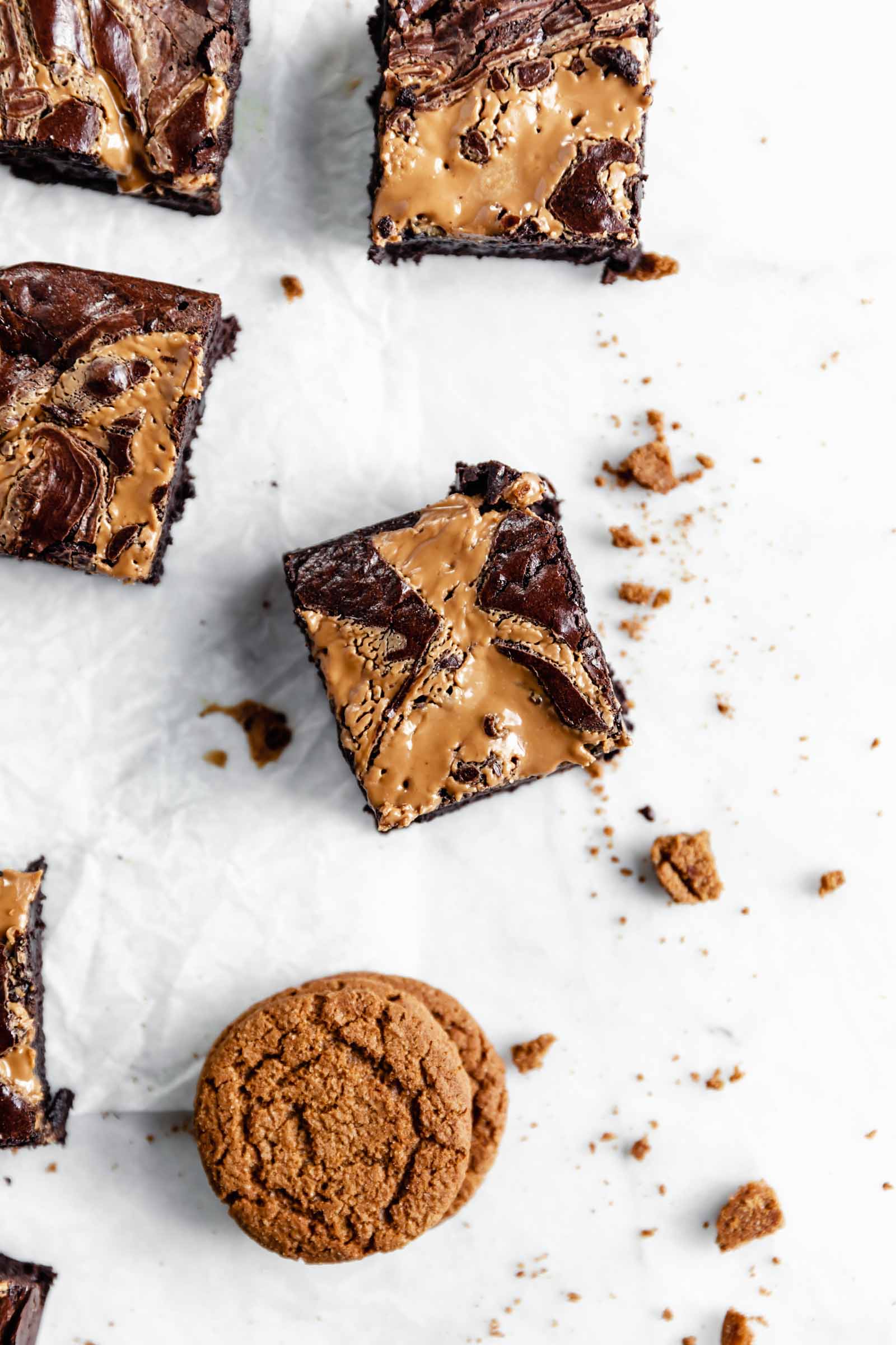 cookie butter swirled brownie on parchment paper