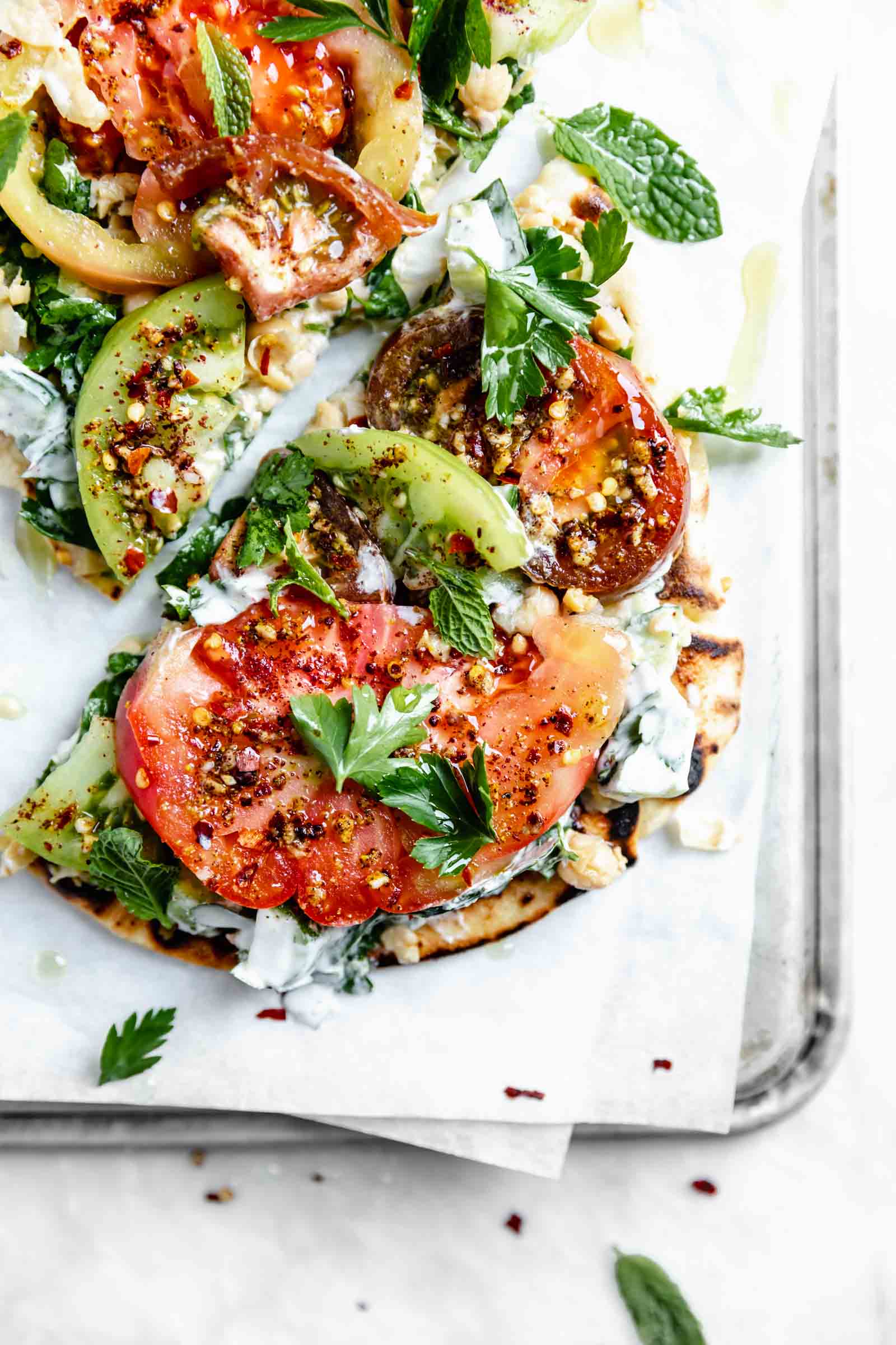 falafel-spiced tomato and chickpea flatbread drizzled with olive oil