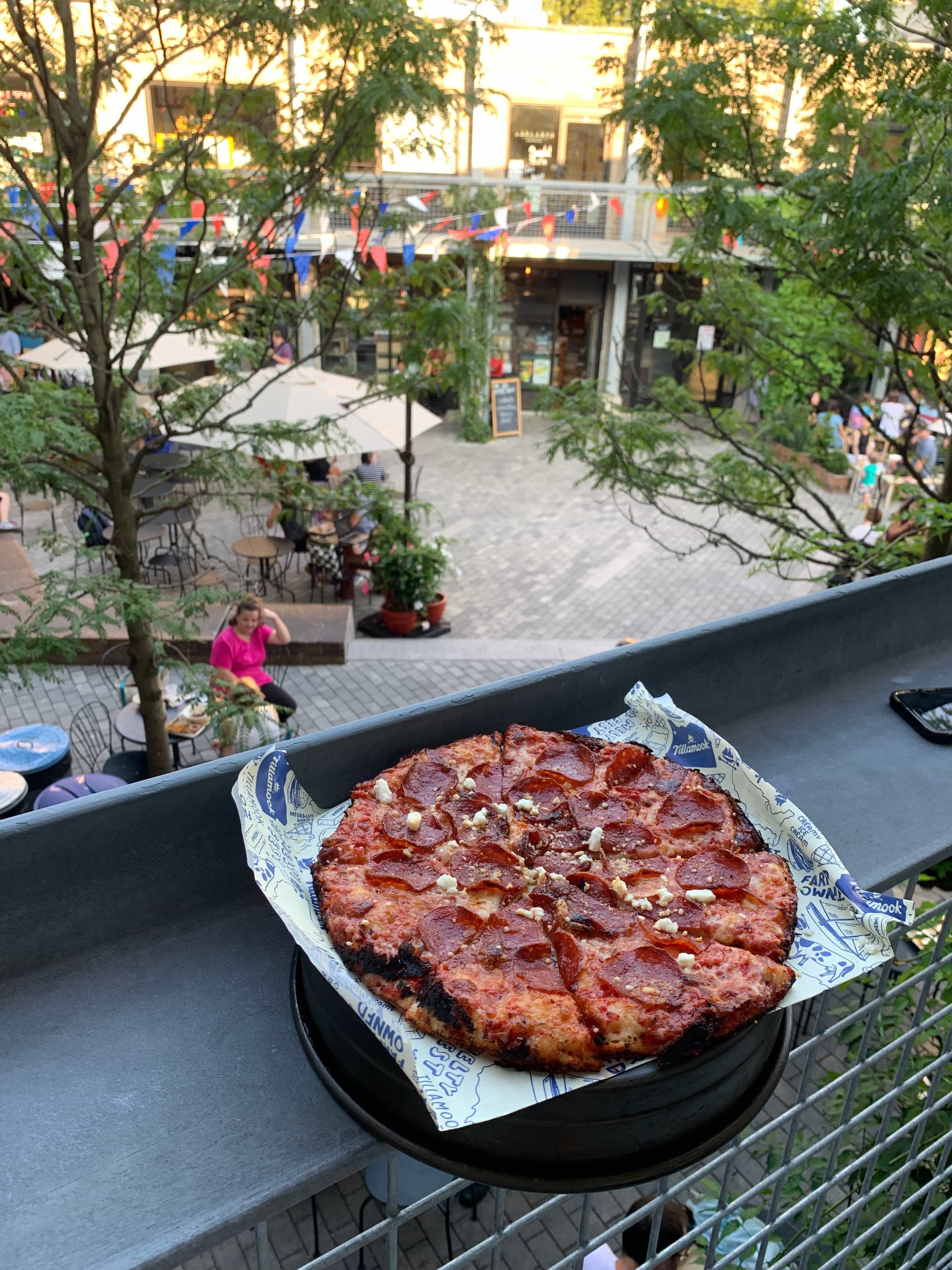 pepperoni pizza on a ledge