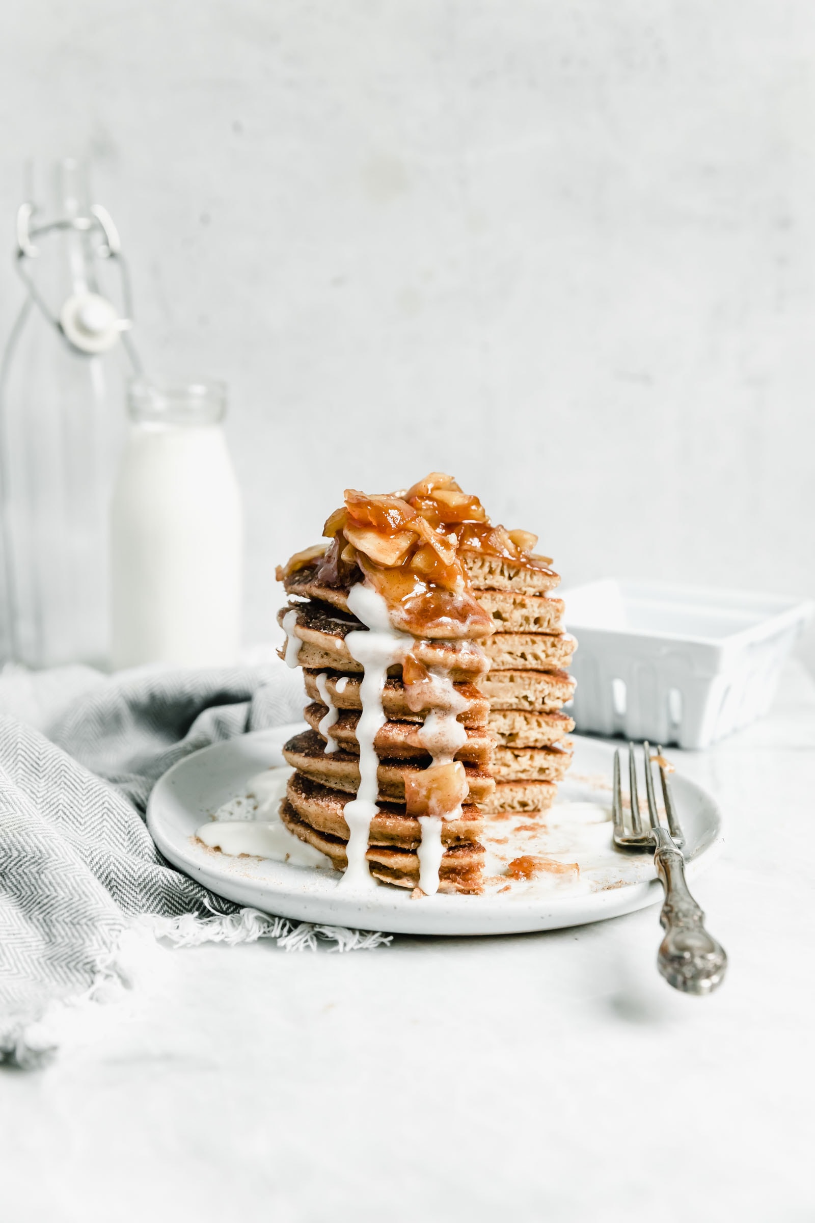 apple cider donut pancakes with bite taken out