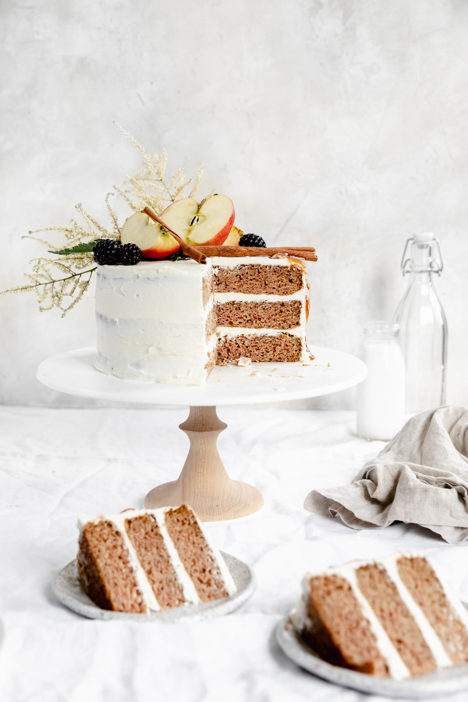 caramel apple cake with two slices on plates