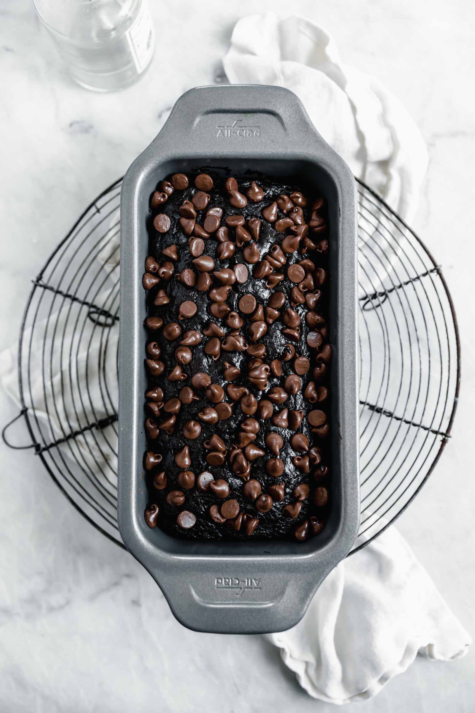 chocolate zucchini bread on loaf pan on wire rack