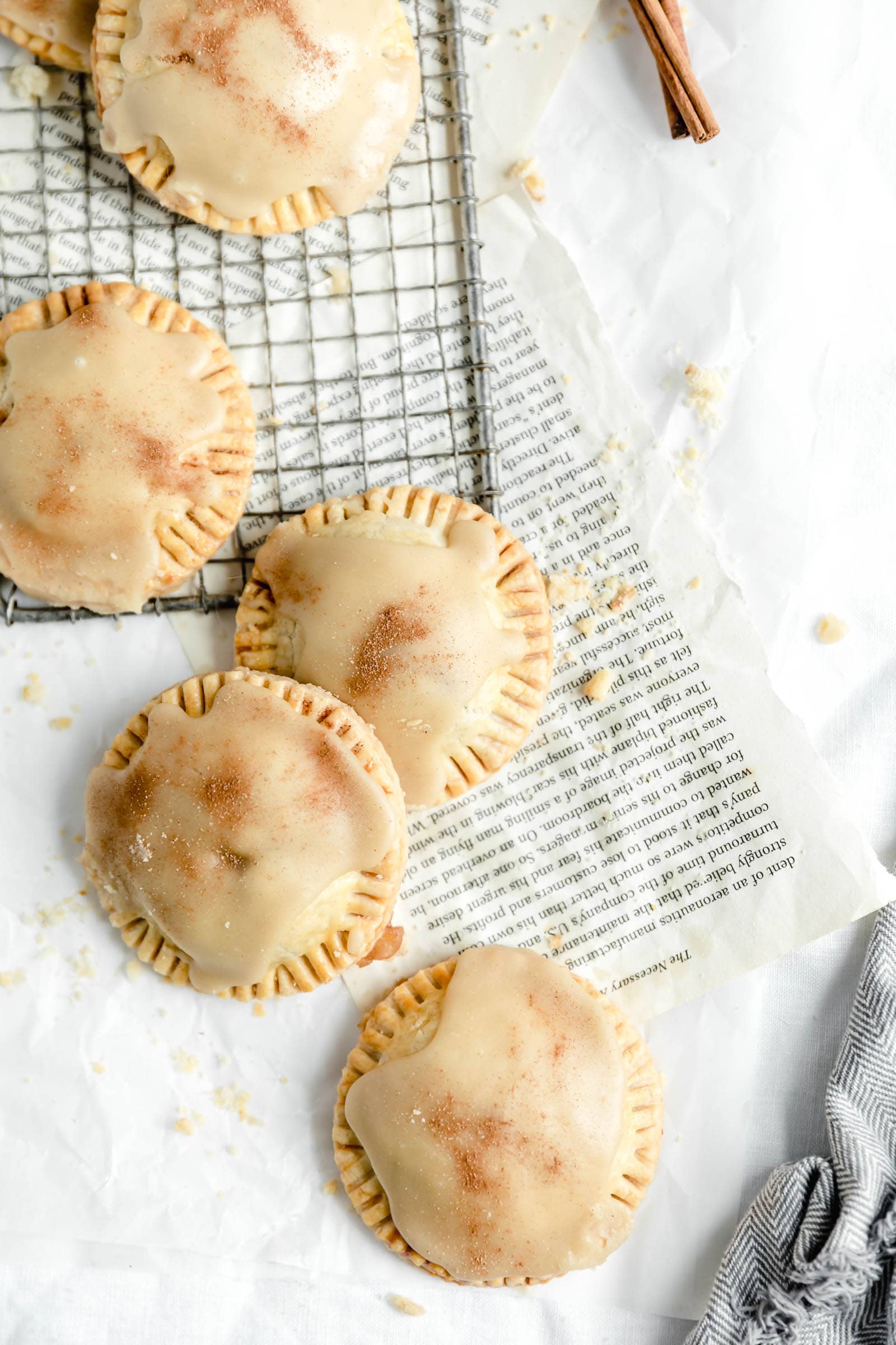 overhead shot of mini apple pies with maple frosting