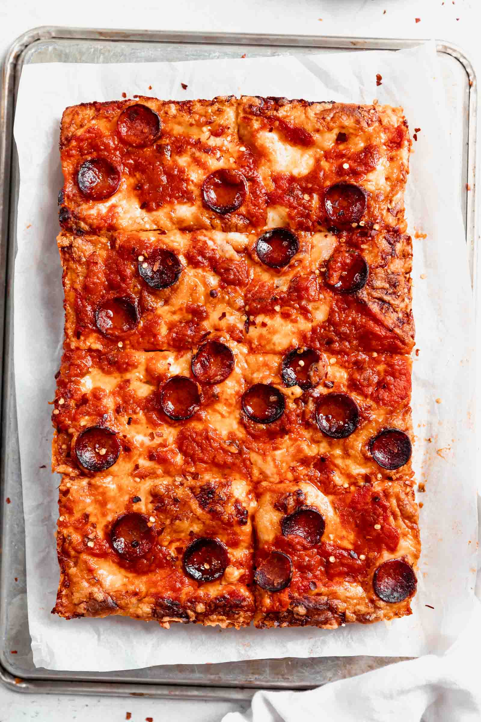 Crispy on the outside, chewy in the middle, Detroit-Style Pizza topped with two pounds of cheese, sauce, and your choice of topping. Um, can you say drool?