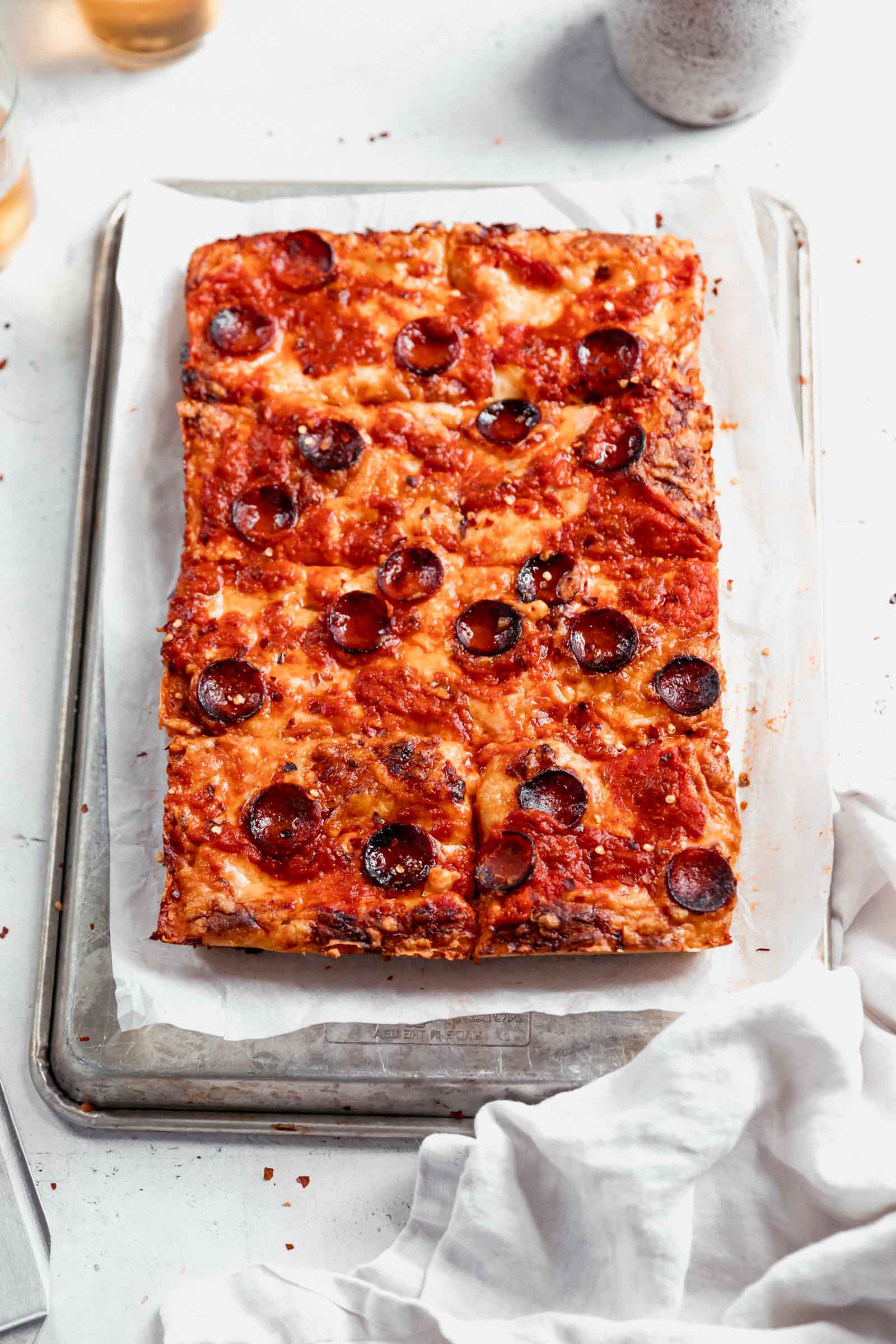 Crispy on the outside, chewy in the middle, Detroit-Style Pizza topped with two pounds of cheese, sauce, and your choice of topping. Um, can you say drool?