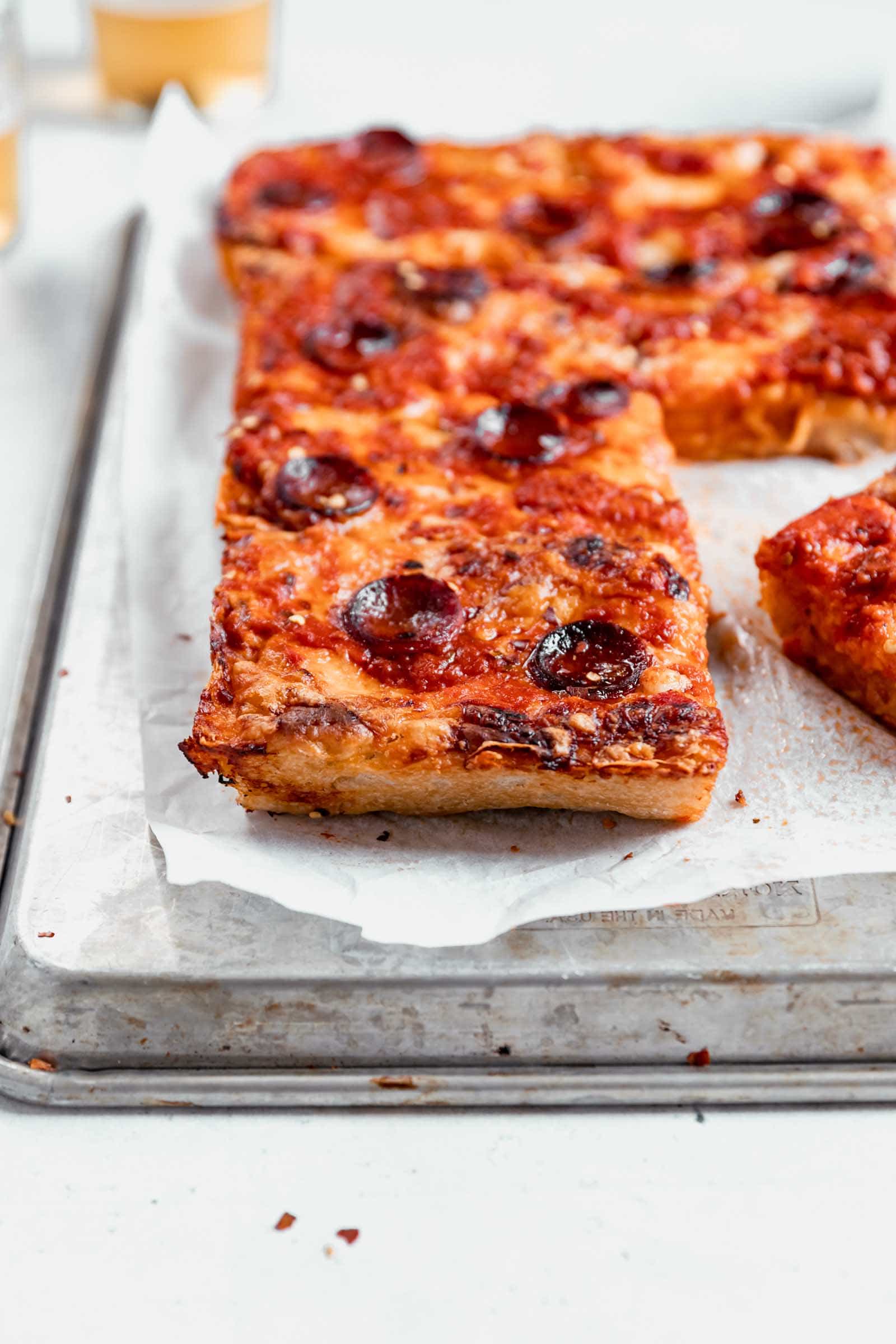 Crispy on the outside, chewy in the middle, Detroit-Style Pizza topped with two pounds of cheese, sauce, and your choice of topping. Um, can you say drool?