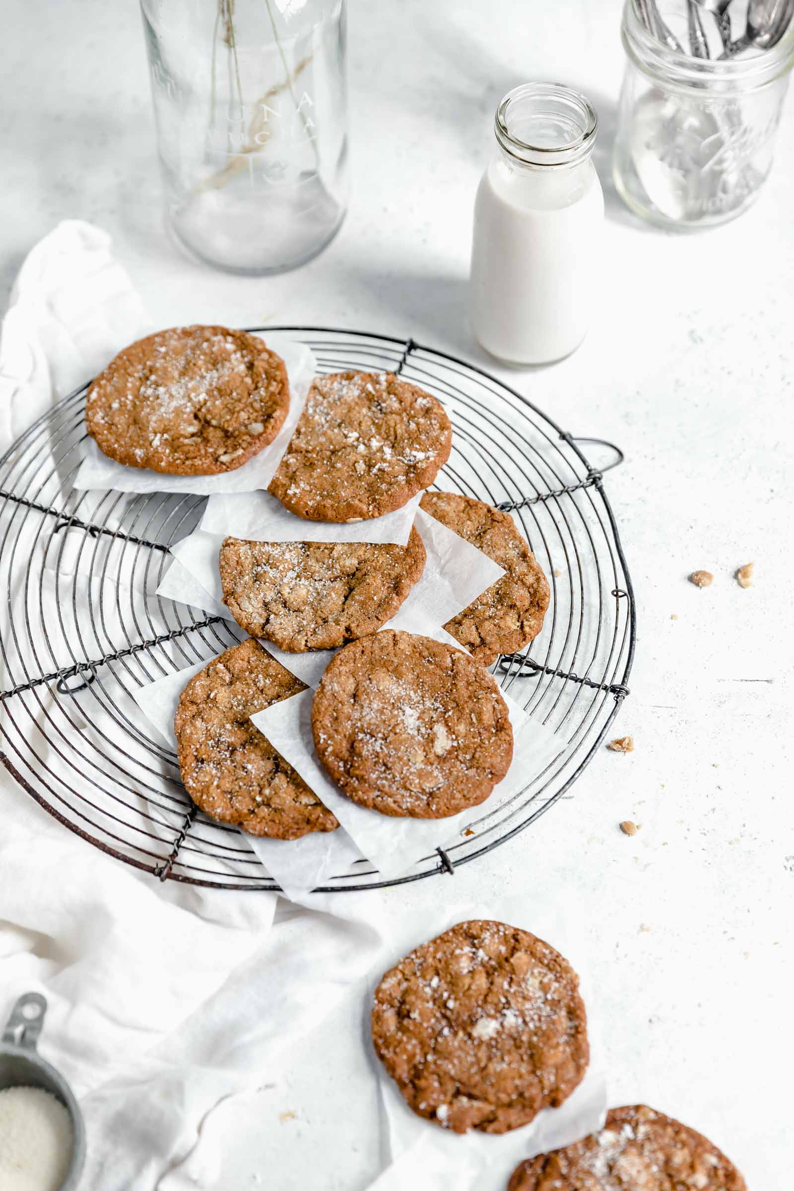 ginger oatmeal cookies coated in sugar on a cooling rack