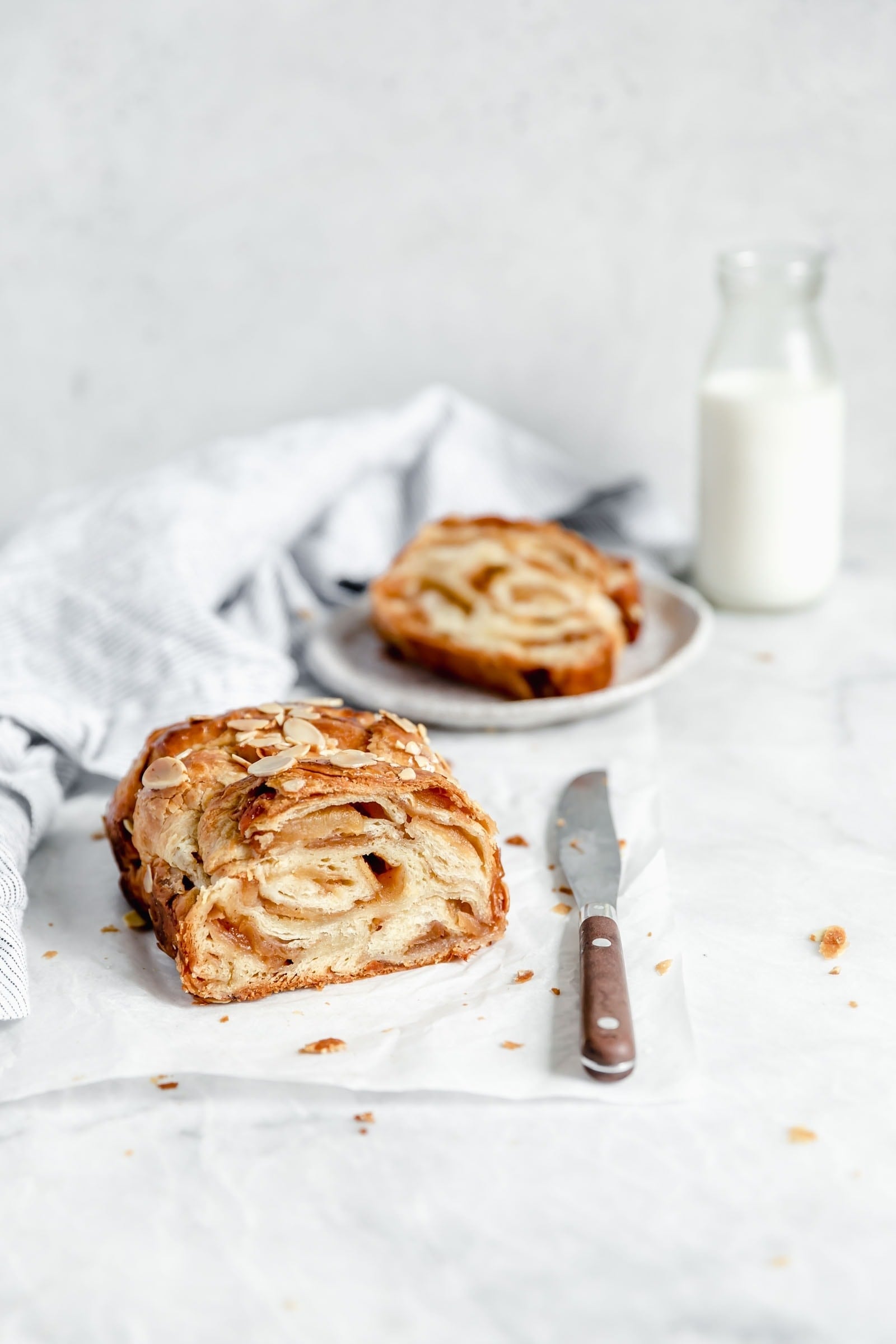 cinnamon apple babka cut in half with a knife 