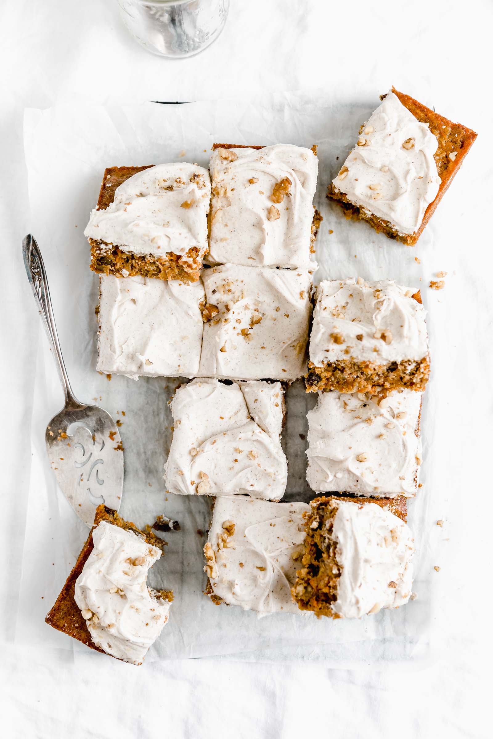 overhead shot of carrot cake sheet cake with a spoonful of frosting