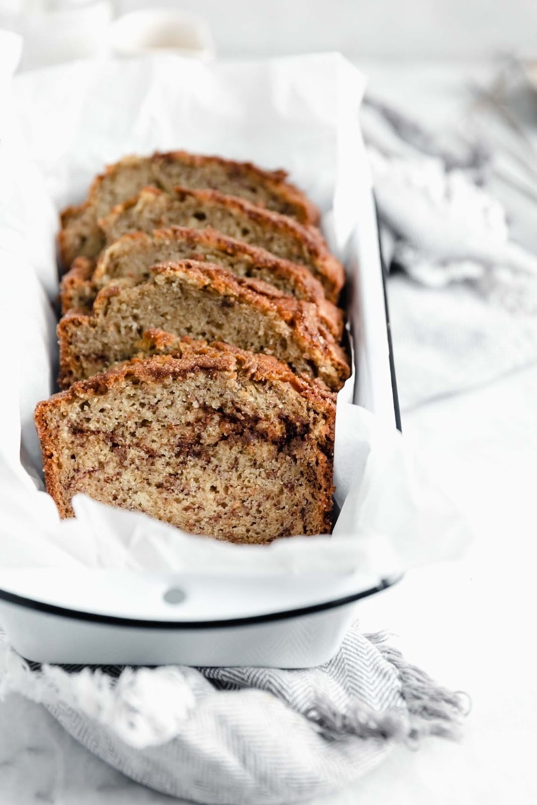 snickerdoodle banana bread sliced and fanned out in loaf pan