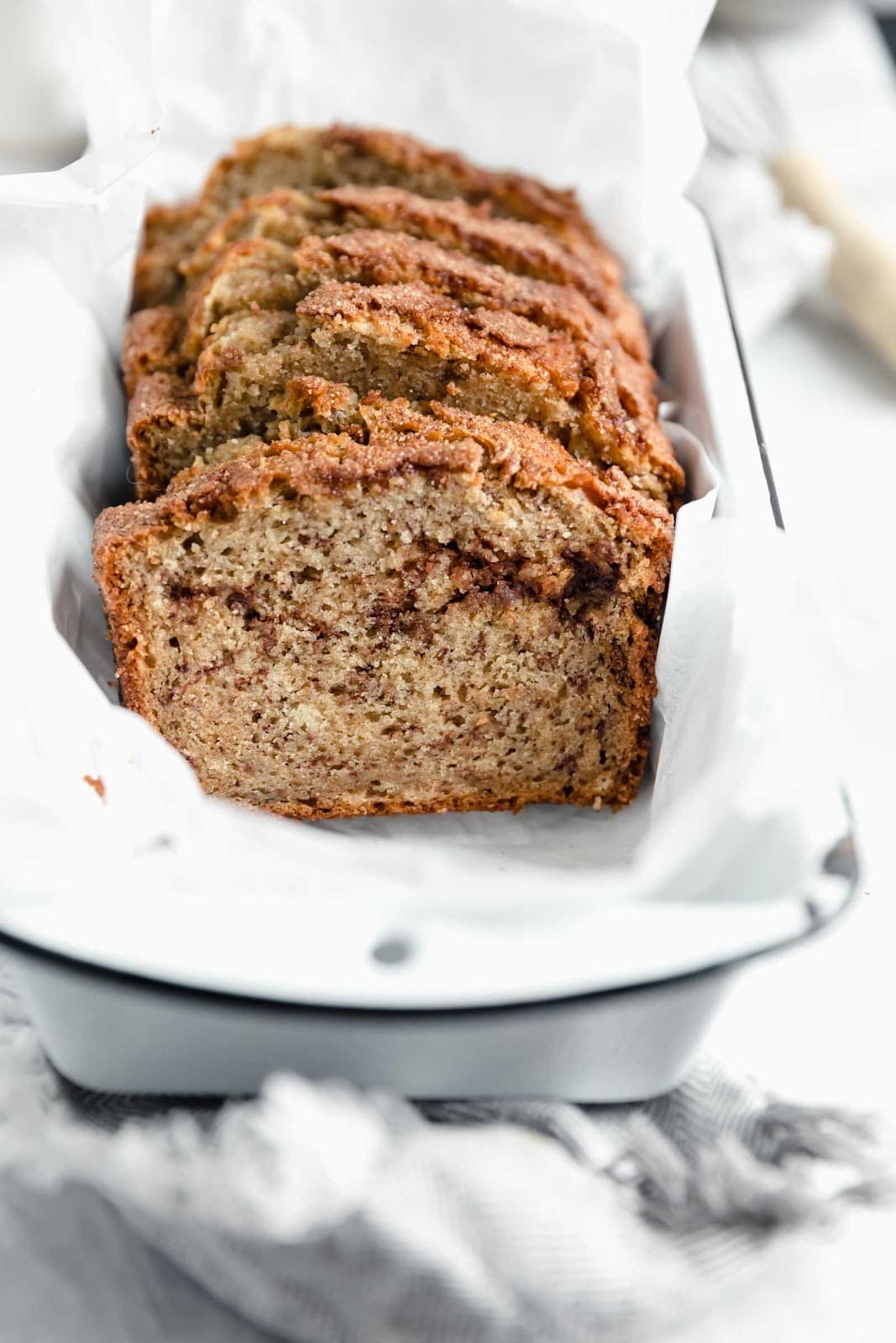 cinnamon sugar banana bread with cinnamon swirl in loaf pan