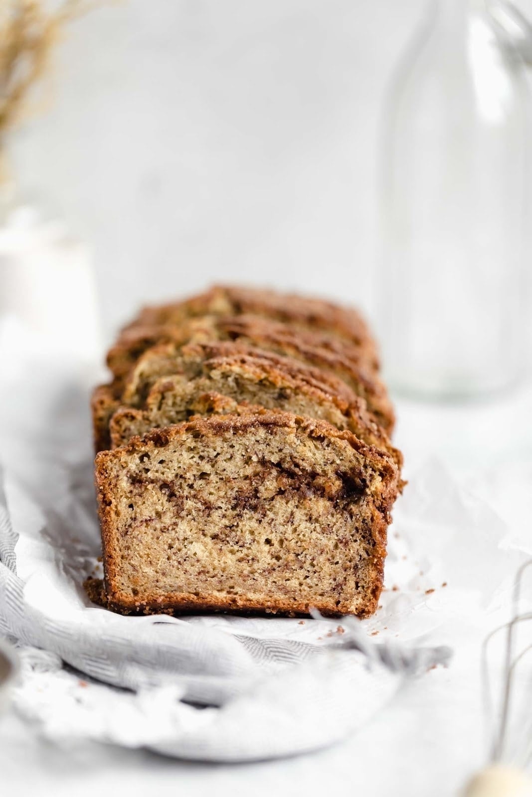 slices of snickerdoodle banana bread with a thick cinnamon sugar swirl