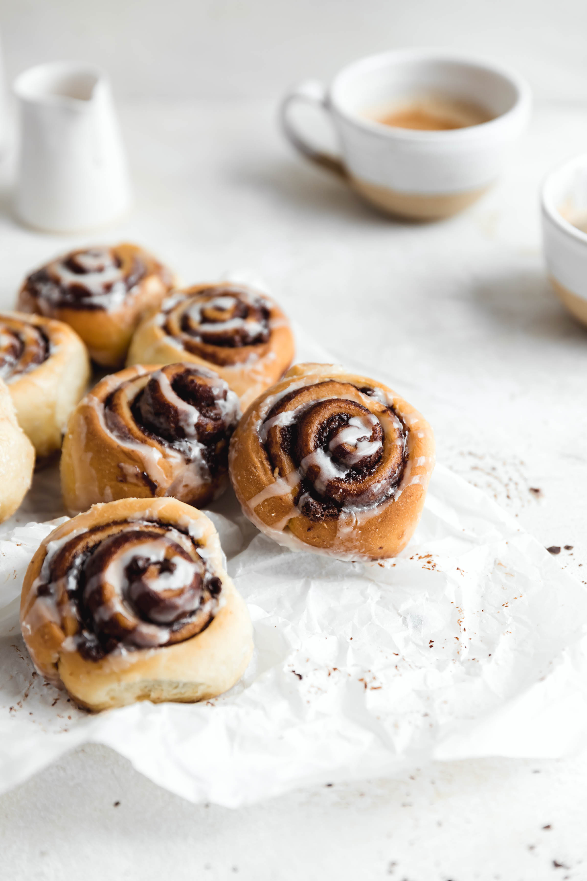 chocolate cinnamon rolls on parchment paper perfect for a weekend breakfast this holiday season
