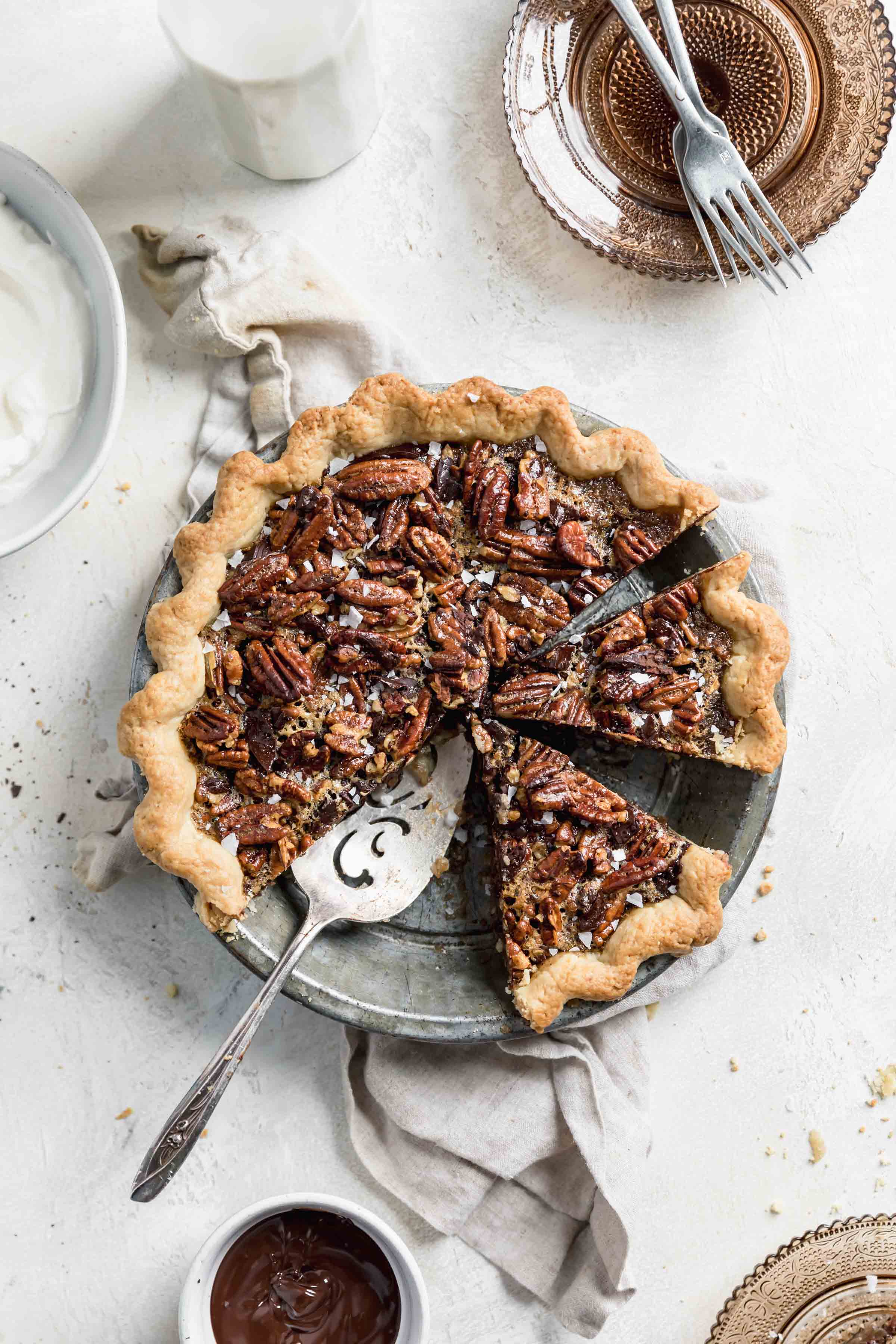 Take your pie game to the next level this Thanksgiving with this Bourbon Chocolate Pecan Pie. Loaded with chocolate chunks and a splash of bourbon, this pecan pie is the perfect ending to your Thanksgiving feast!