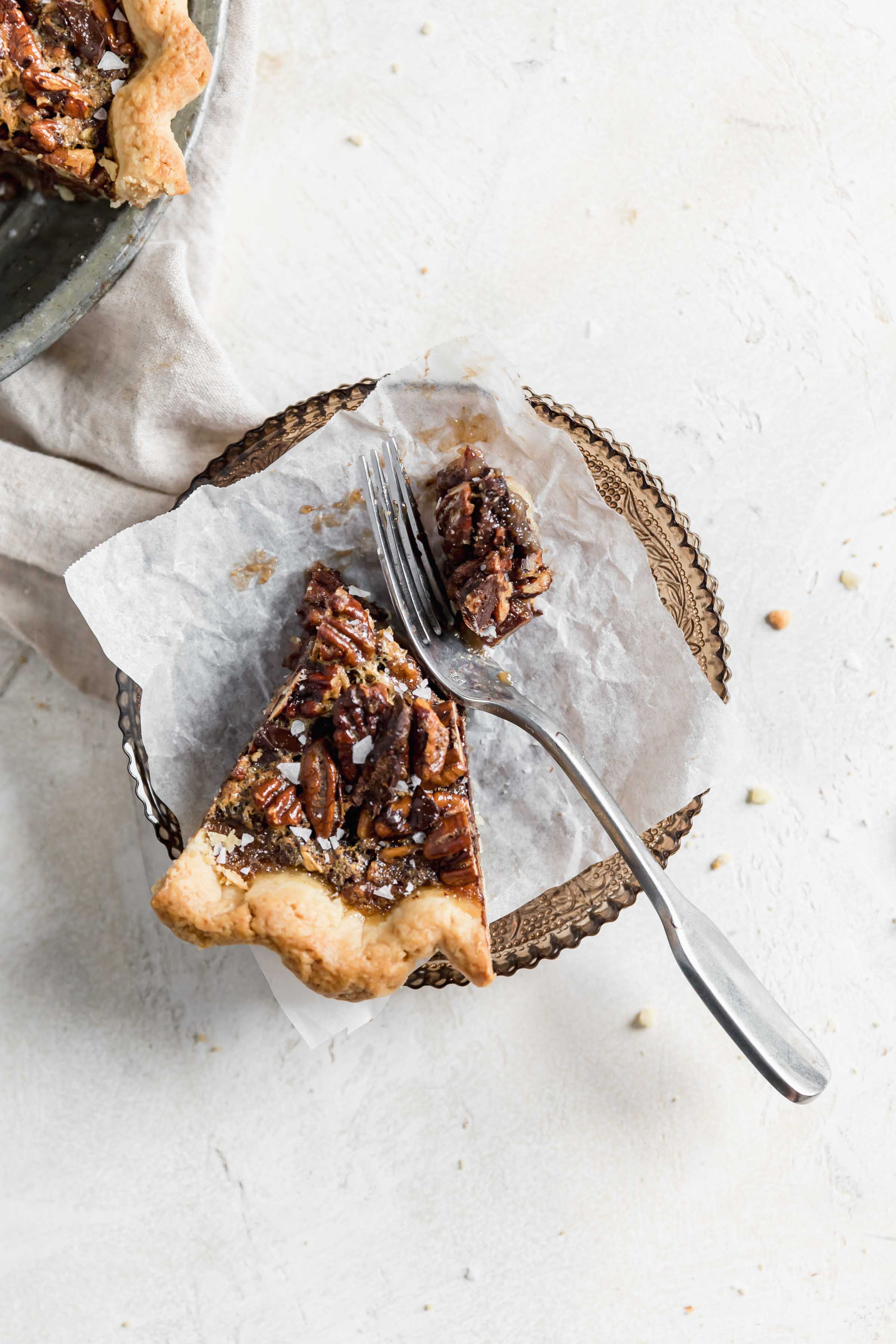 Take your pie game to the next level this Thanksgiving with this Bourbon Chocolate Pecan Pie. Loaded with chocolate chunks and a splash of bourbon, this pecan pie is the perfect ending to your Thanksgiving feast!