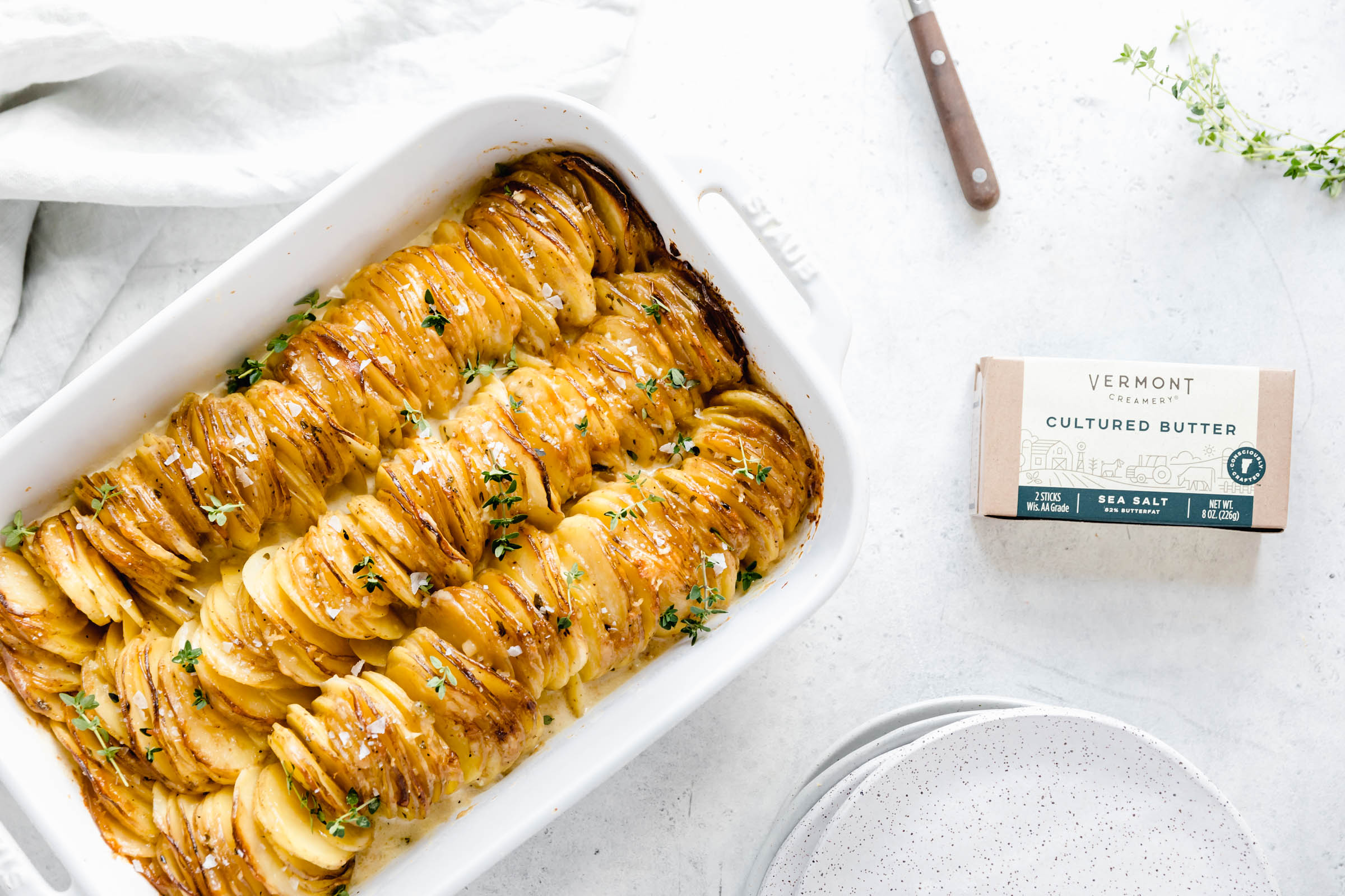 Cheesy Scalloped Potatoes stacked vertically to create a crispy, gooey, cheesy side dish the whole family will love!