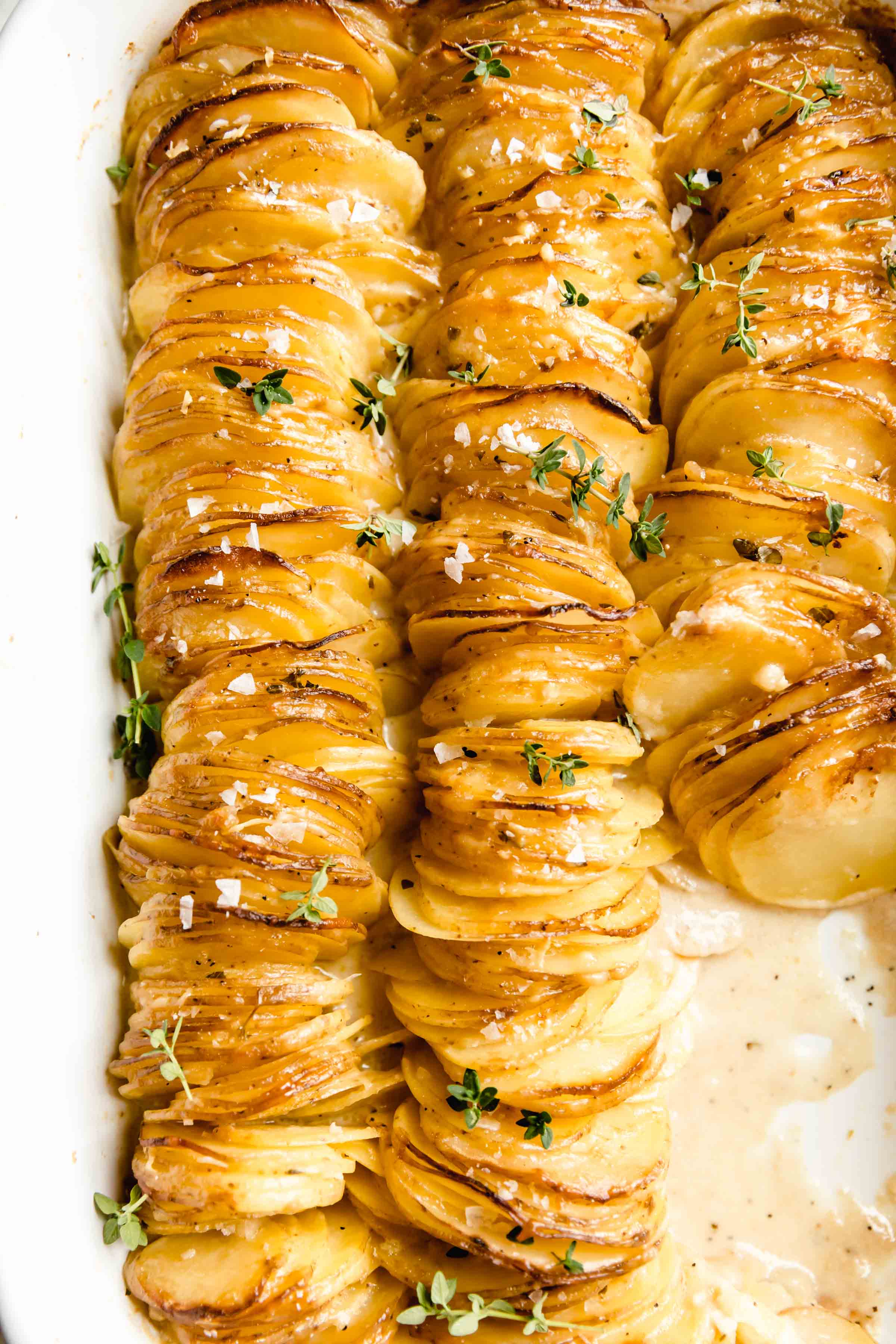 Cheesy Scalloped Potatoes stacked vertically to create a crispy, gooey, cheesy side dish the whole family will love!