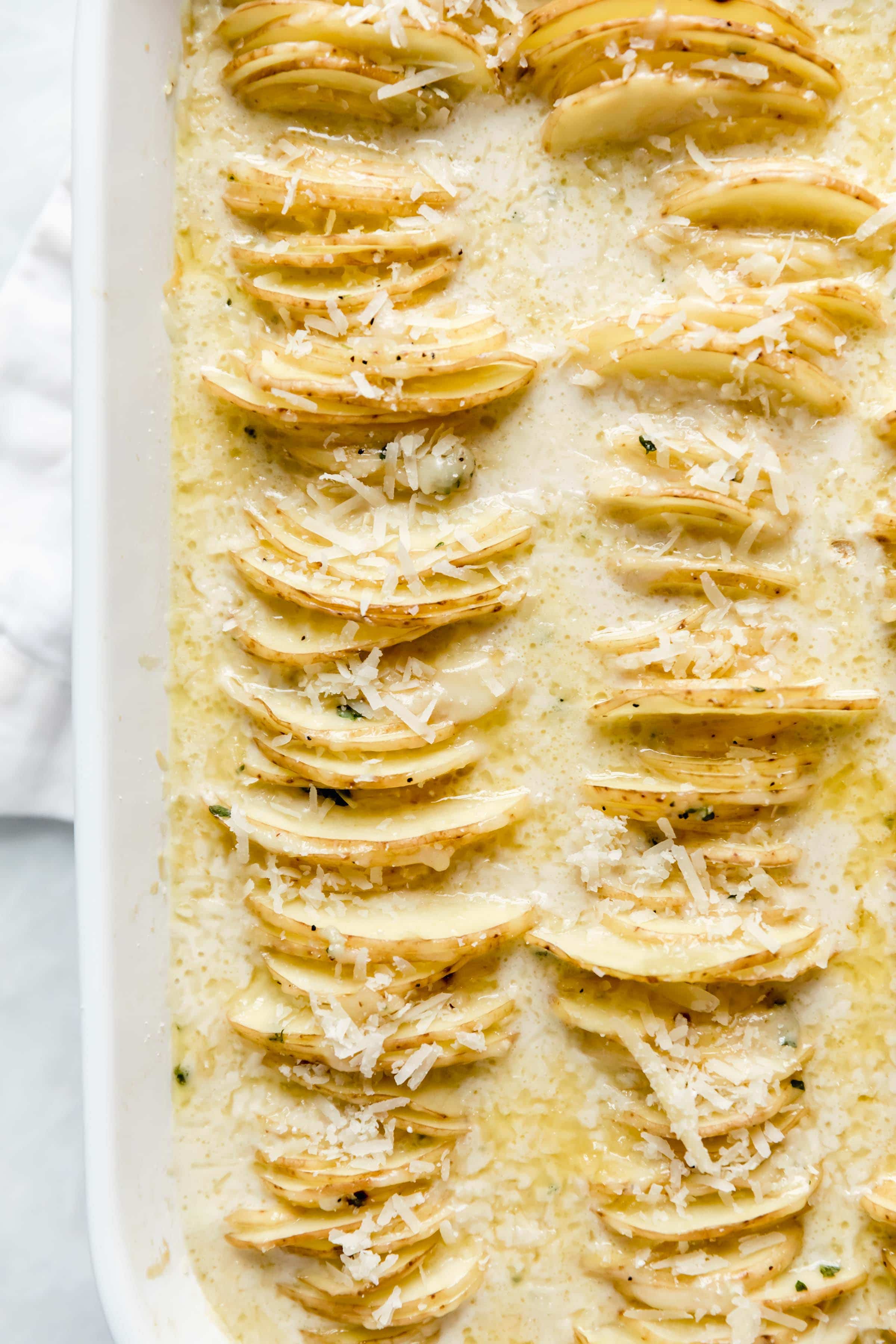 Cheesy Scalloped Potatoes stacked vertically to create a crispy, gooey, cheesy side dish the whole family will love!