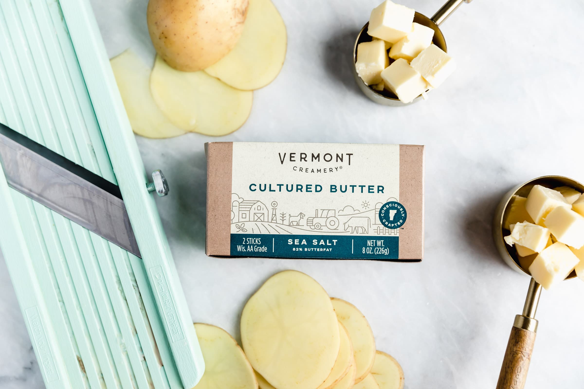 Cheesy Scalloped Potatoes stacked vertically to create a crispy, gooey, cheesy side dish the whole family will love!