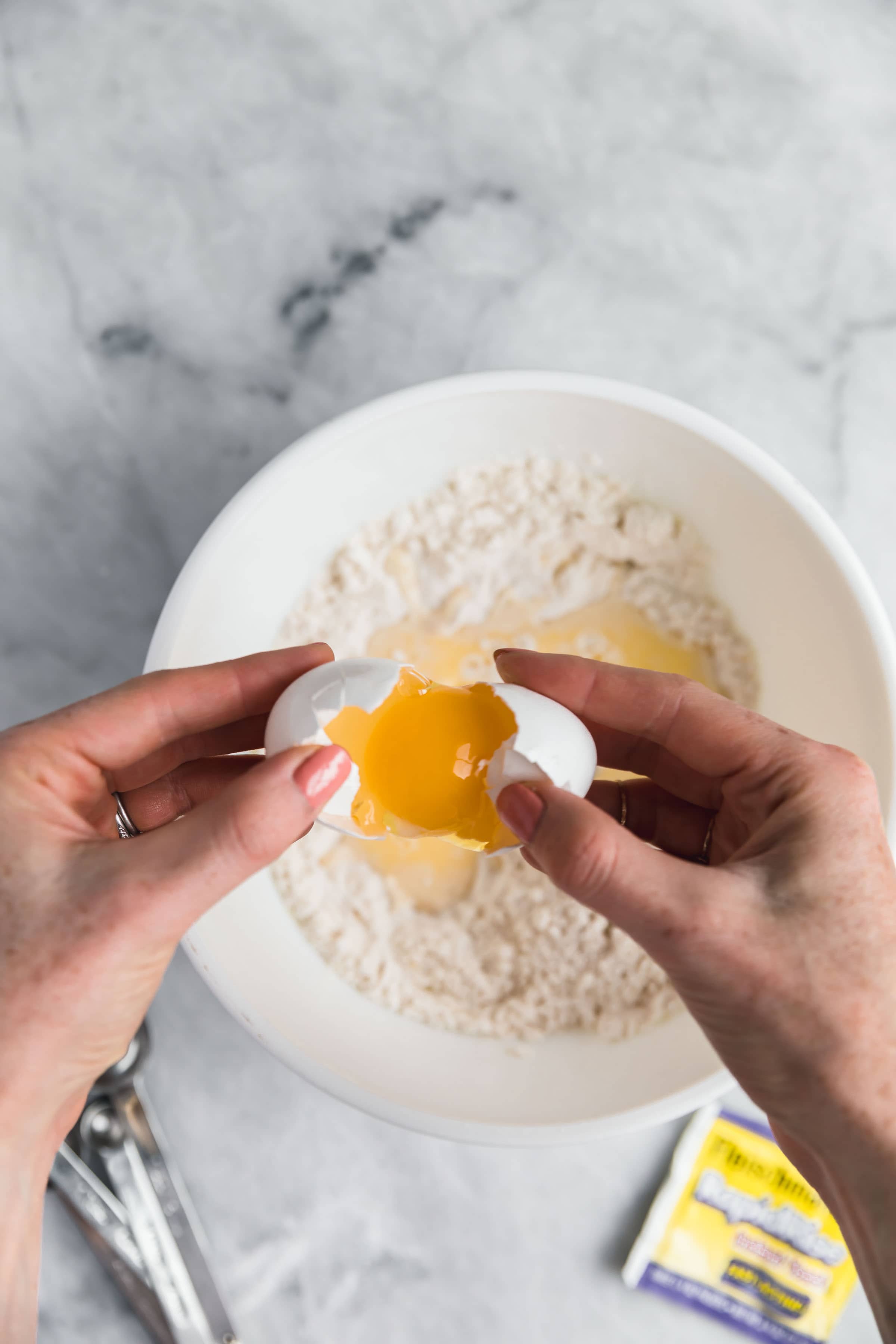 egg cracking into a bowl