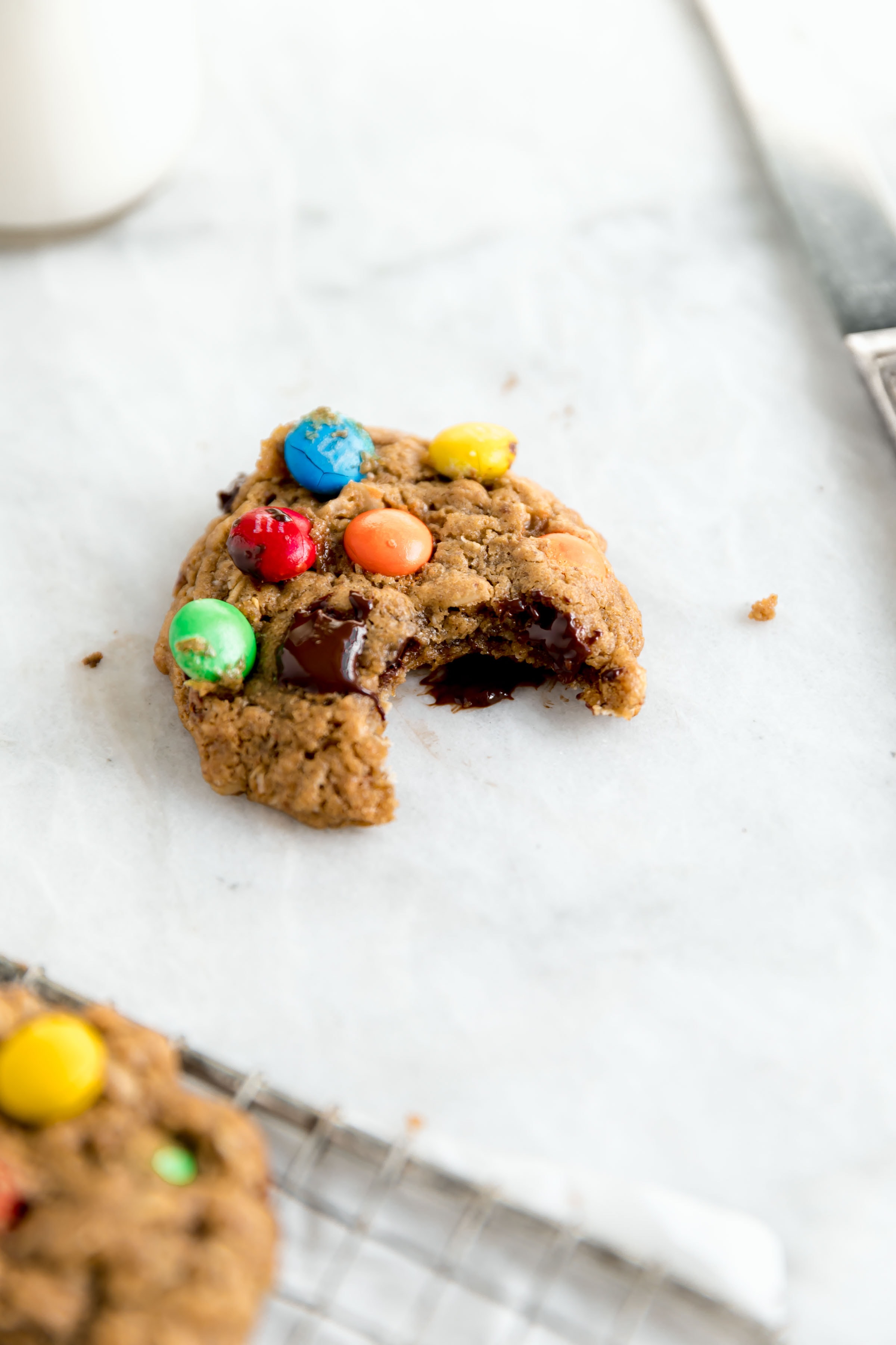 healthy monster cookie with a bite taken out 