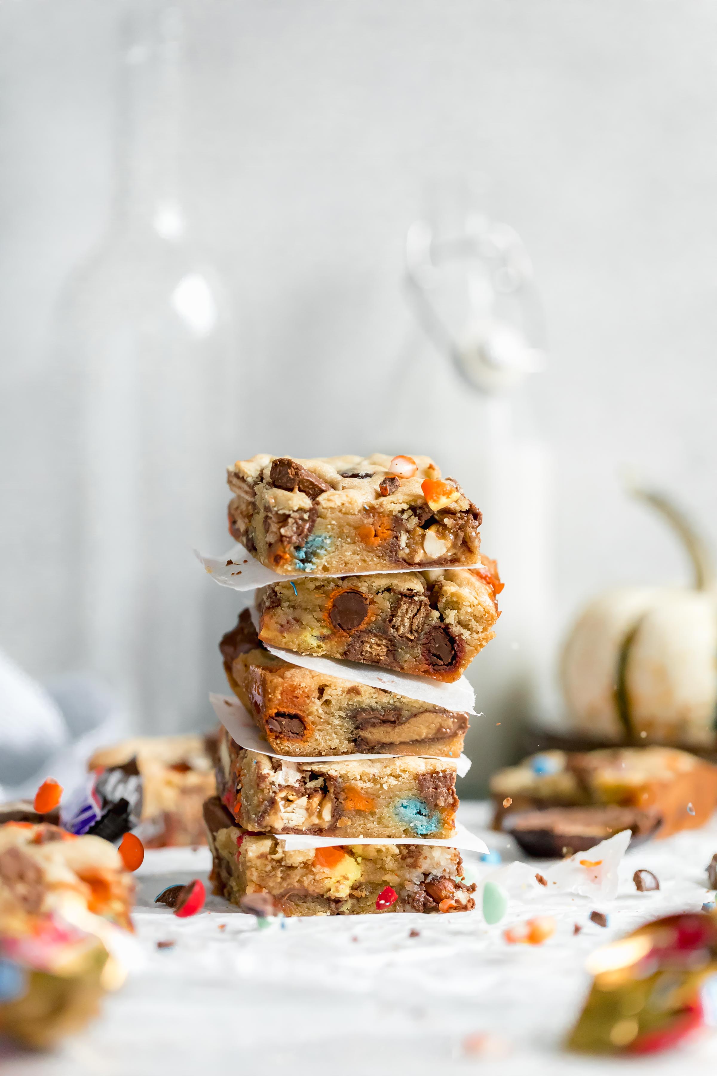 These leftover halloween candy cookie bars come together in one bowl and are a crowd pleaser for grownups and kids alike this Halloween season