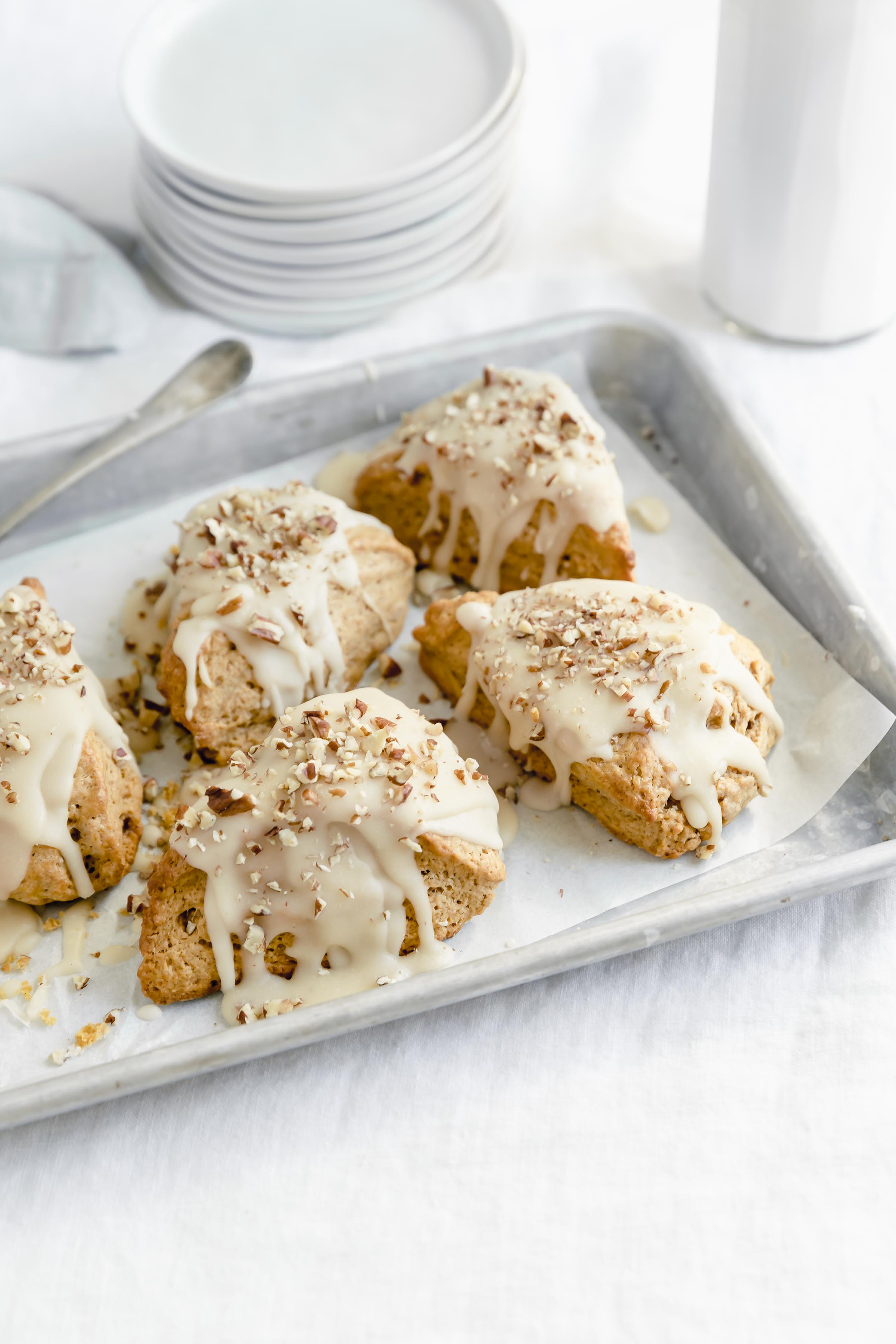 pan of moist pumpkin scones with maple glaze