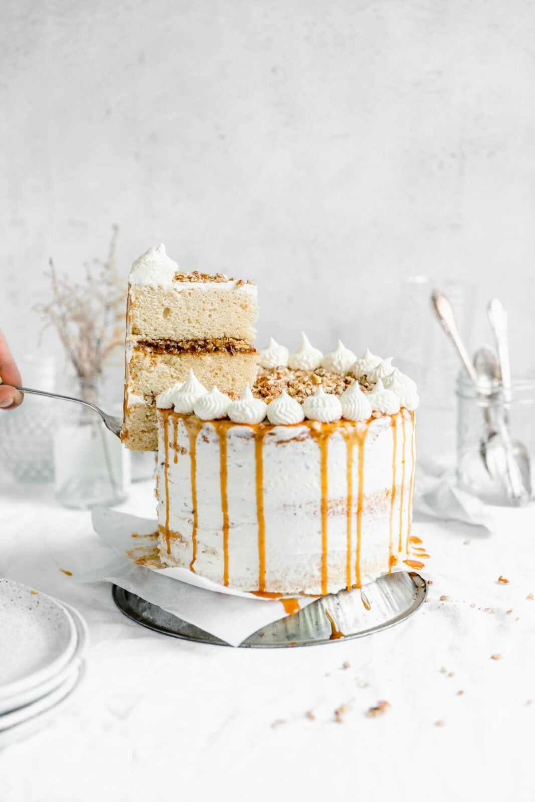 Praline layer with a slice of cake being lifted out. Get it this Thanksgiving season :)