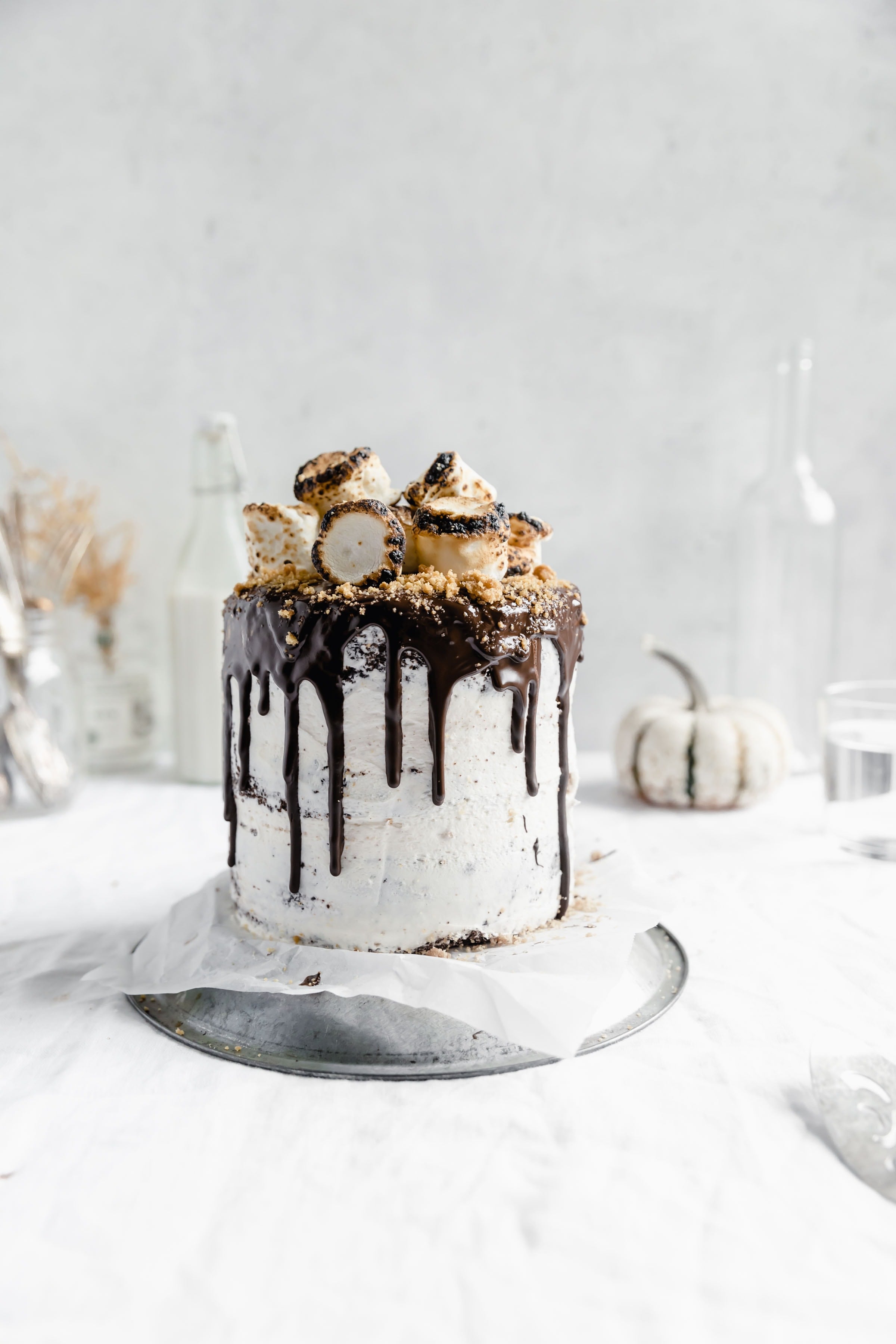 s'more layer cake AKA fudgy chocolate cake with a marshmallow and graham filling, marshmallow frosting, chocolate ganache, and topped with toasted marshmallows.YUM.
