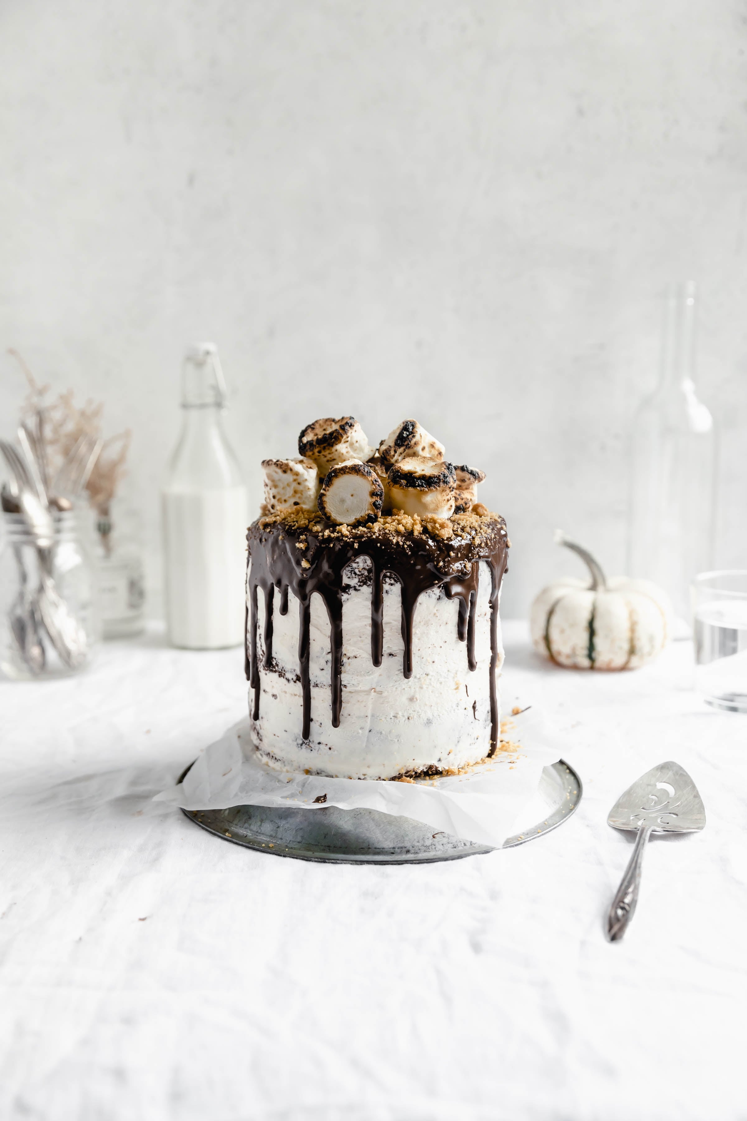 head on shot of s'mores cake with toasted marshmallows on top
