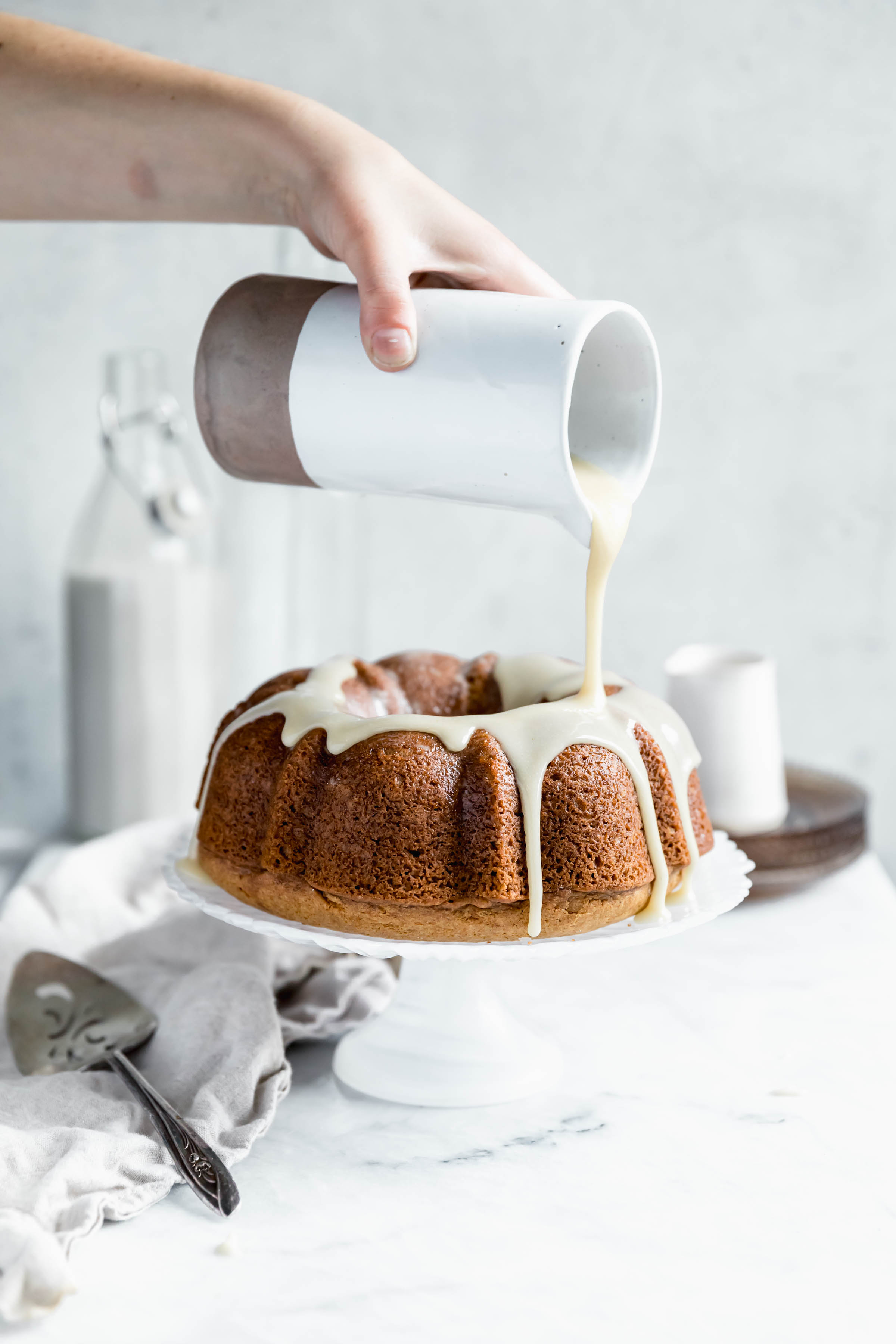 maple icing pour shot over sweet potato bundt cake