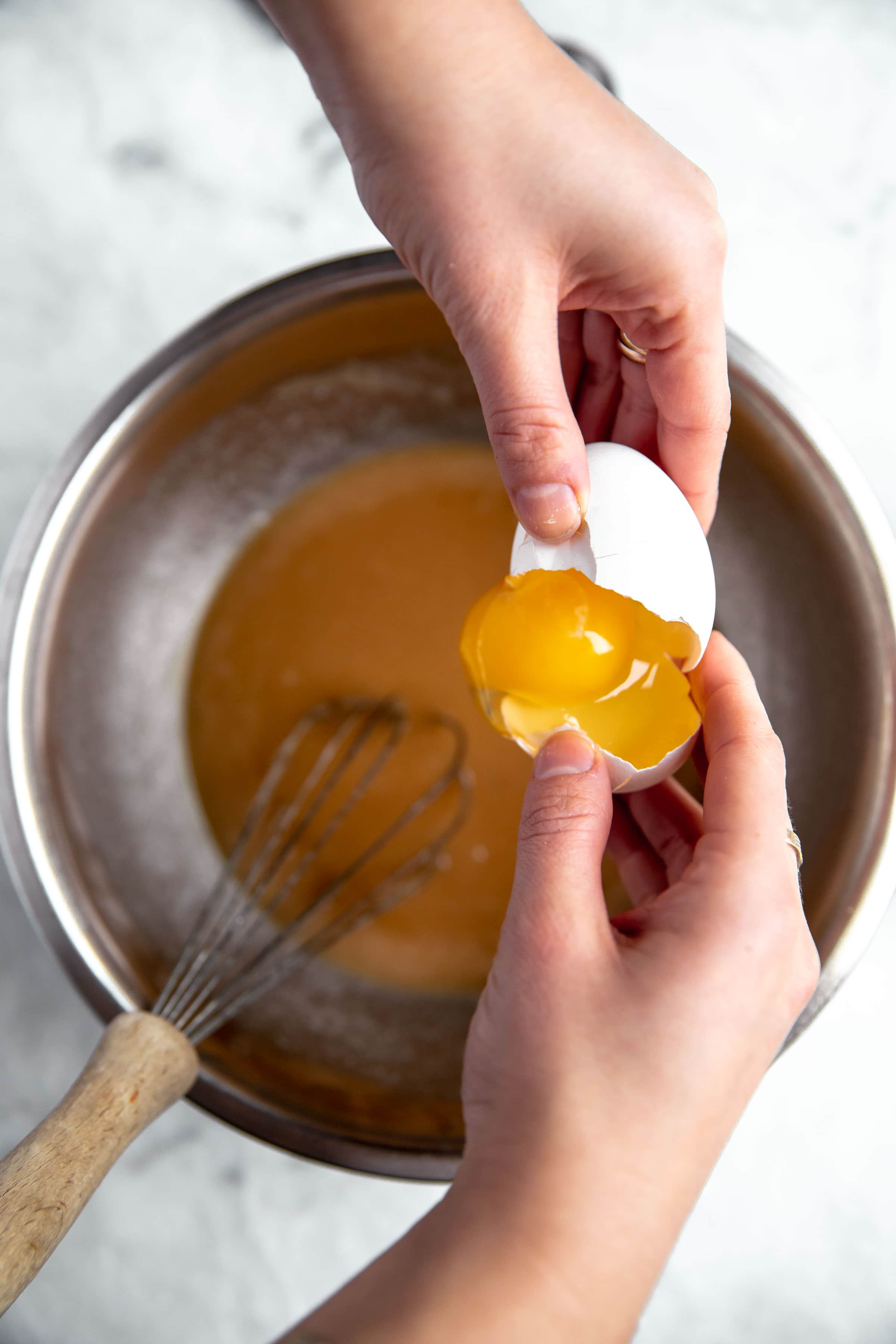 egg cracking into batter