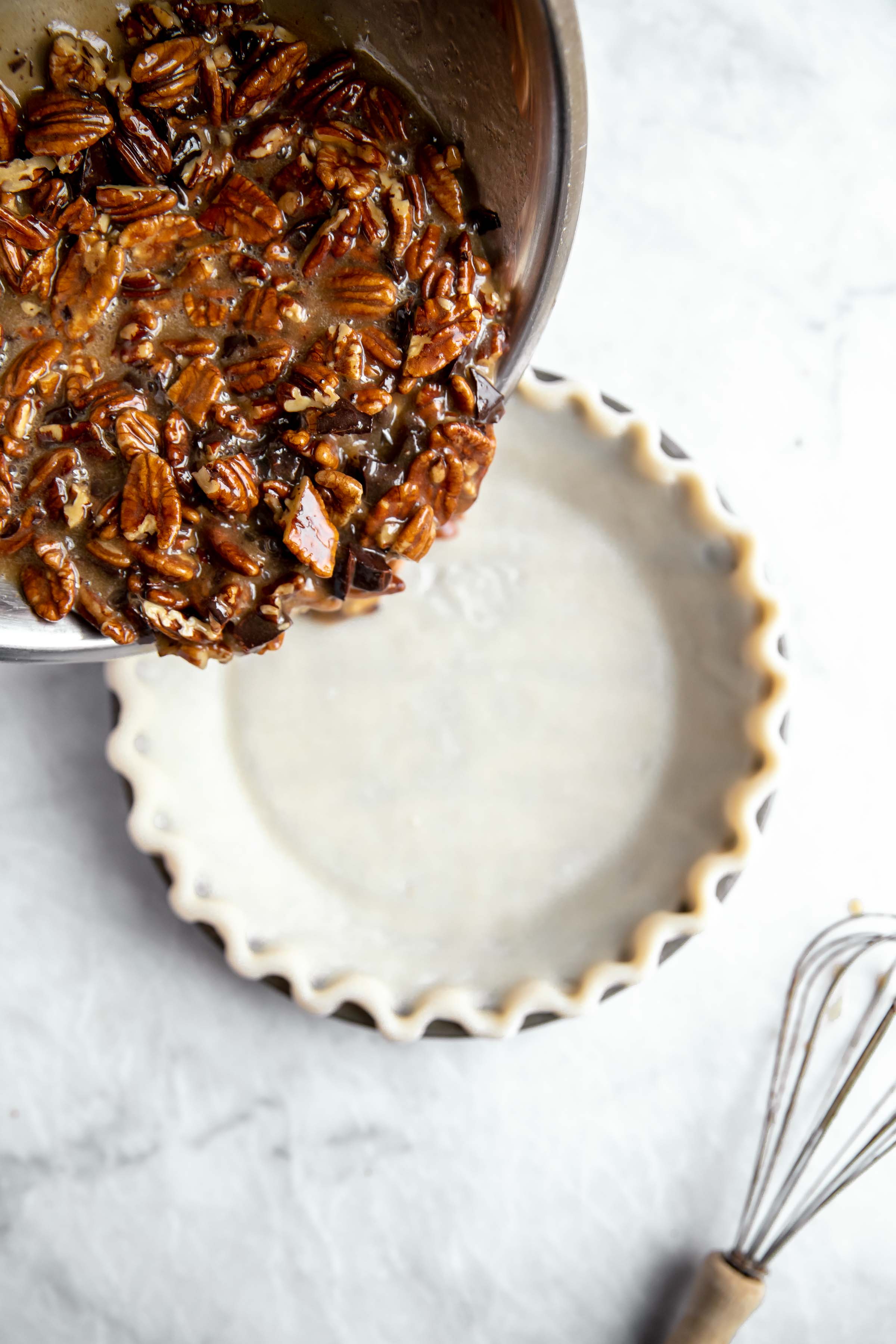 pie filling pouring into pie crust