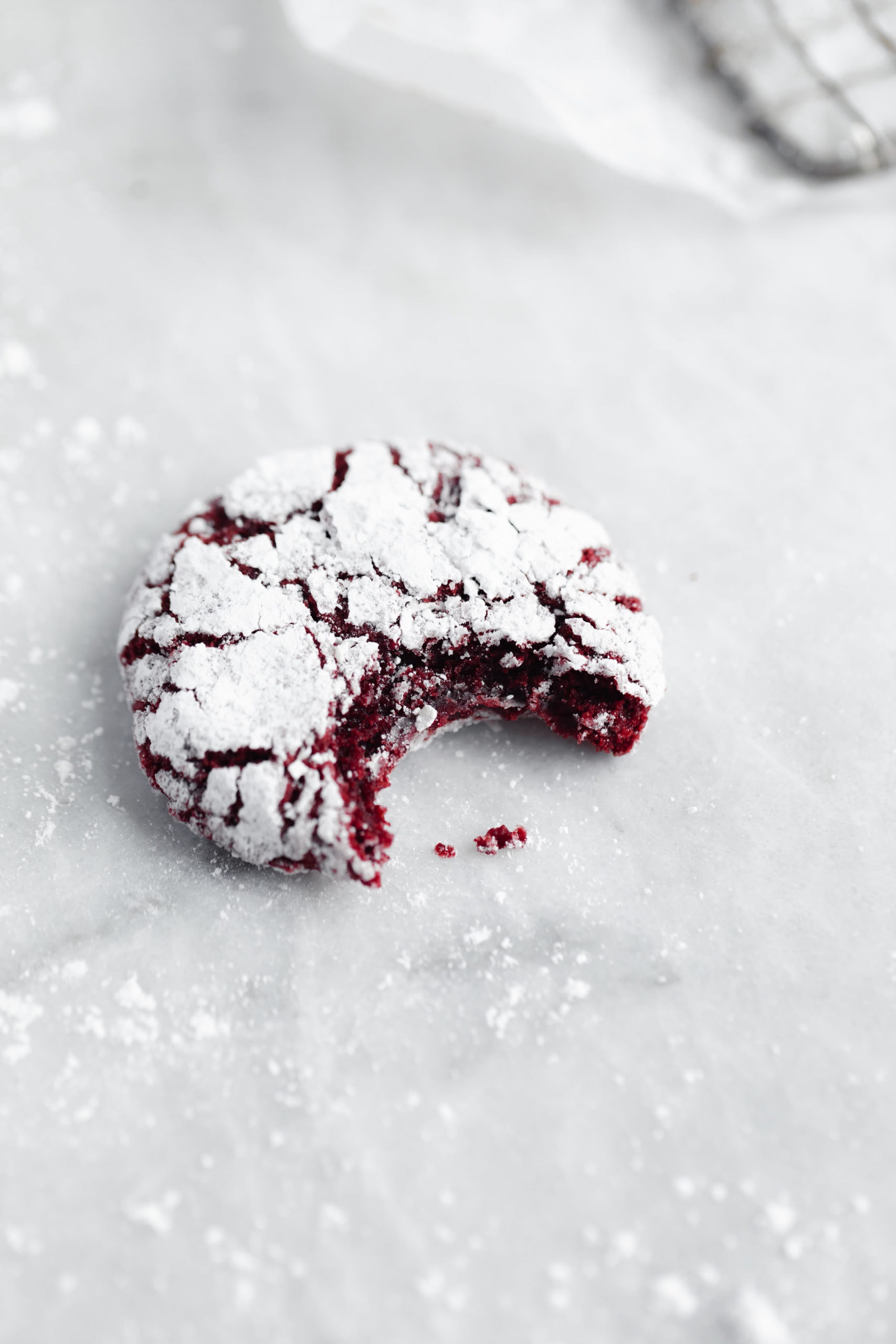 Too goo to resist! Fudgy homemade red velvet Christmas cookie with a bite taken out!